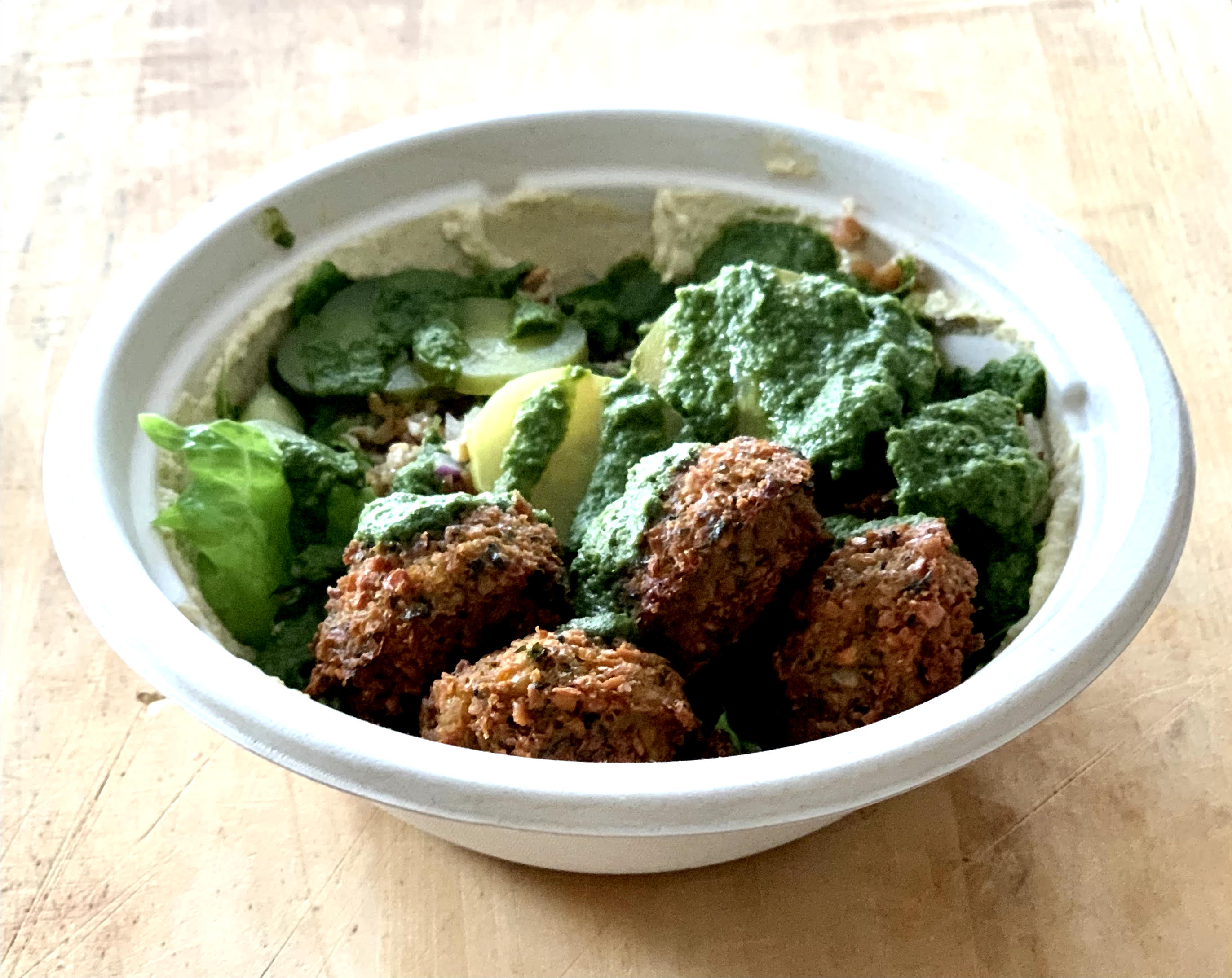 Falafel bowl with hummus and tabbouleh.