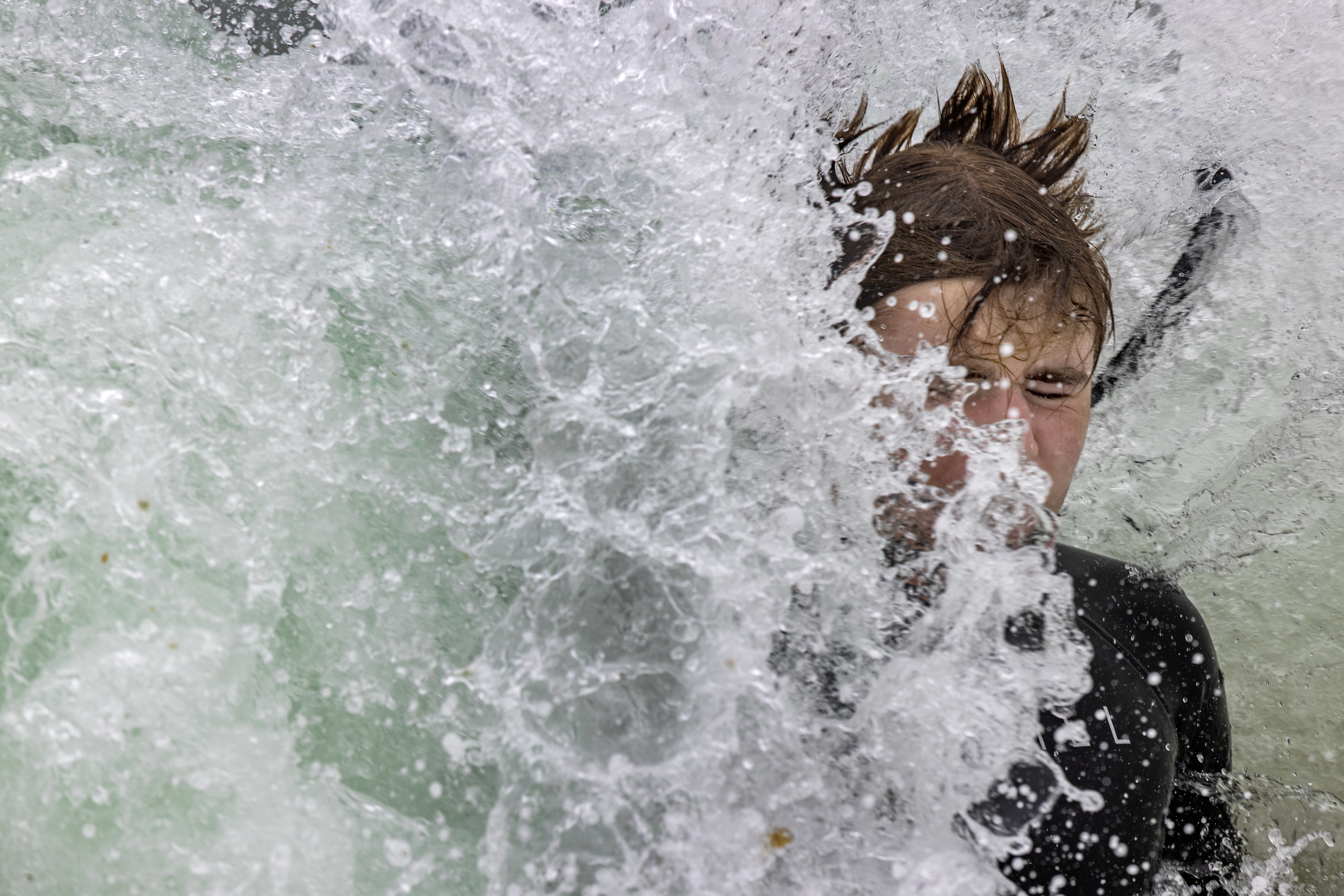 A swimmer meets a wave at Cisco Beach.