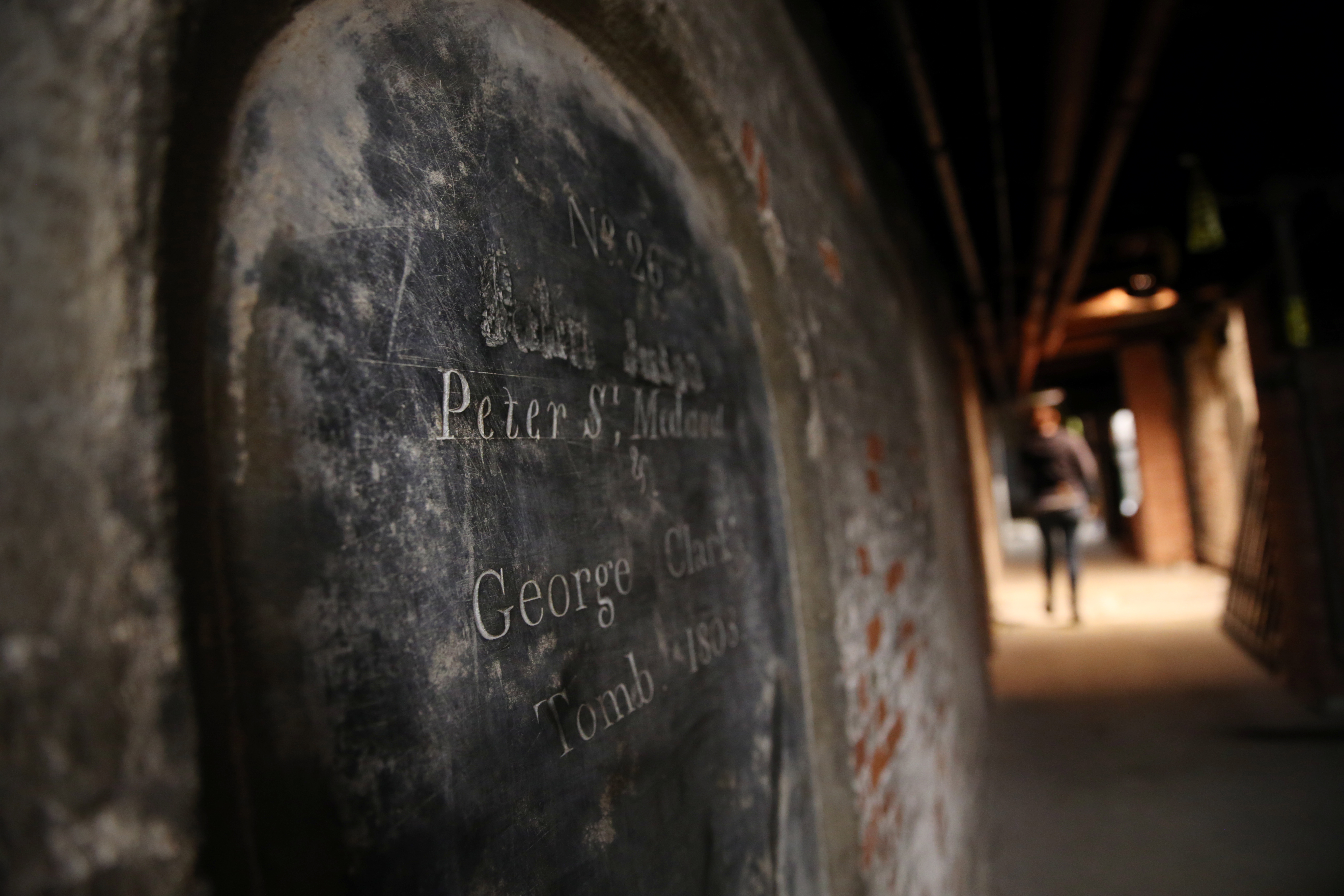 The graves of John Jutau, Peter St. Medard and George Clark in the crypt of Old North Church in Boston on March 17, 2017.
