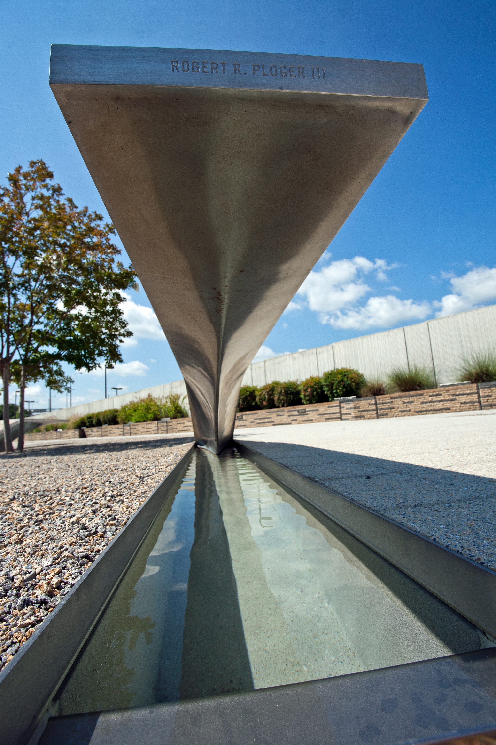 The 9/11 Pentagon Memorial is a stark reminder of lives lost on that day, including passengers of AA Flight 77 and Pentagon employees.