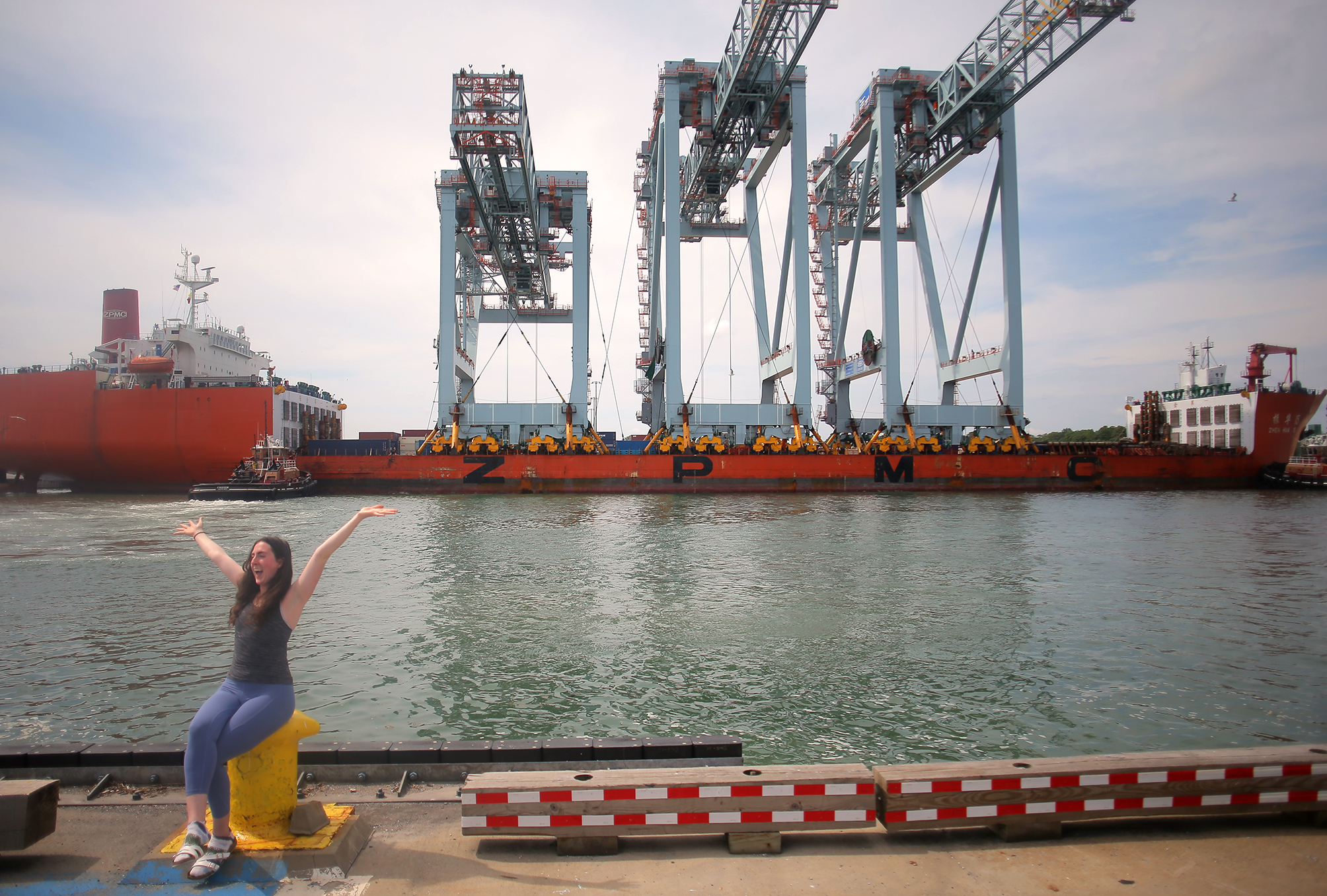 Union longshoreman Kristy Cataloni poses in front of the Zhen Hua 15.