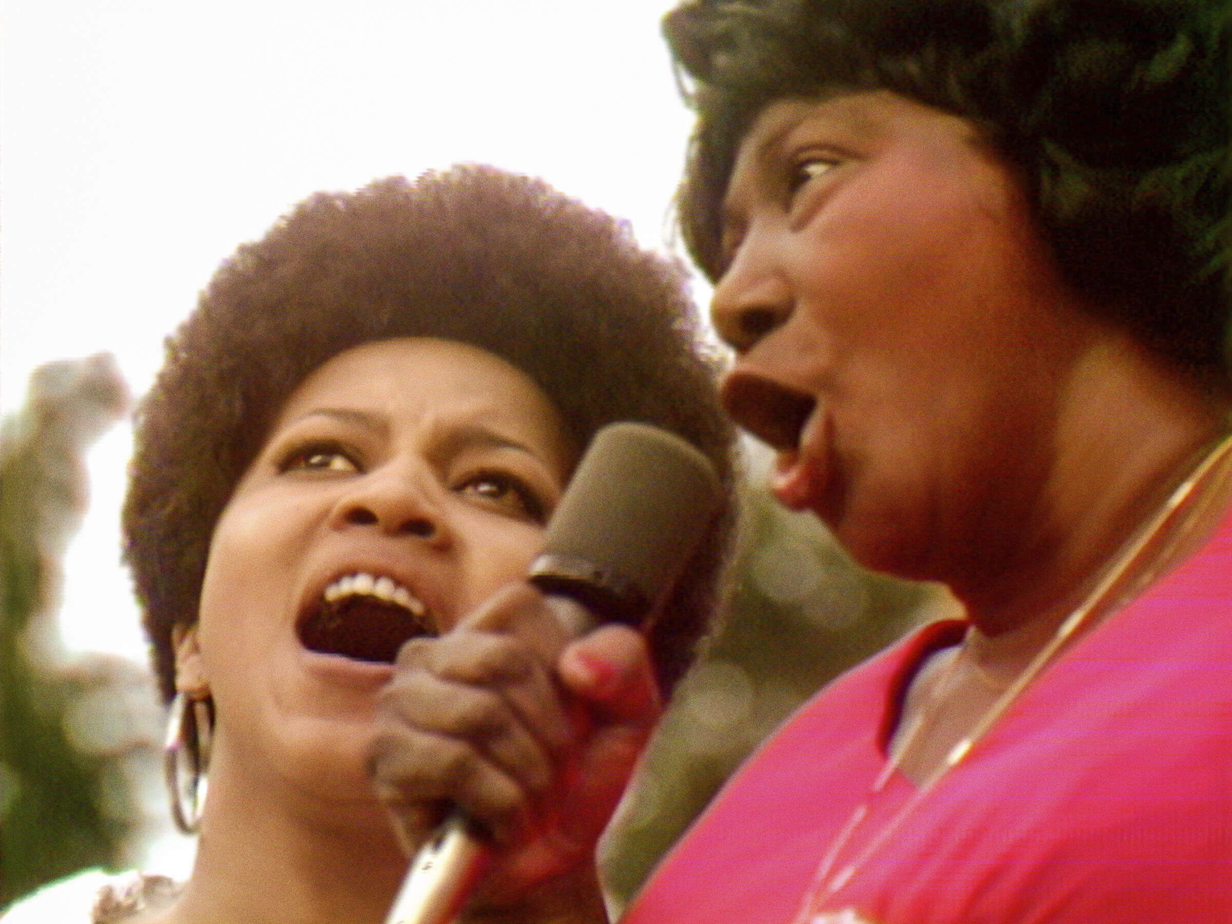 Mavis Staples, left, and Mahalia Jackson performing at the Harlem Cultural Festival in 1969, in a scene from the documentary "The summer of the soul."