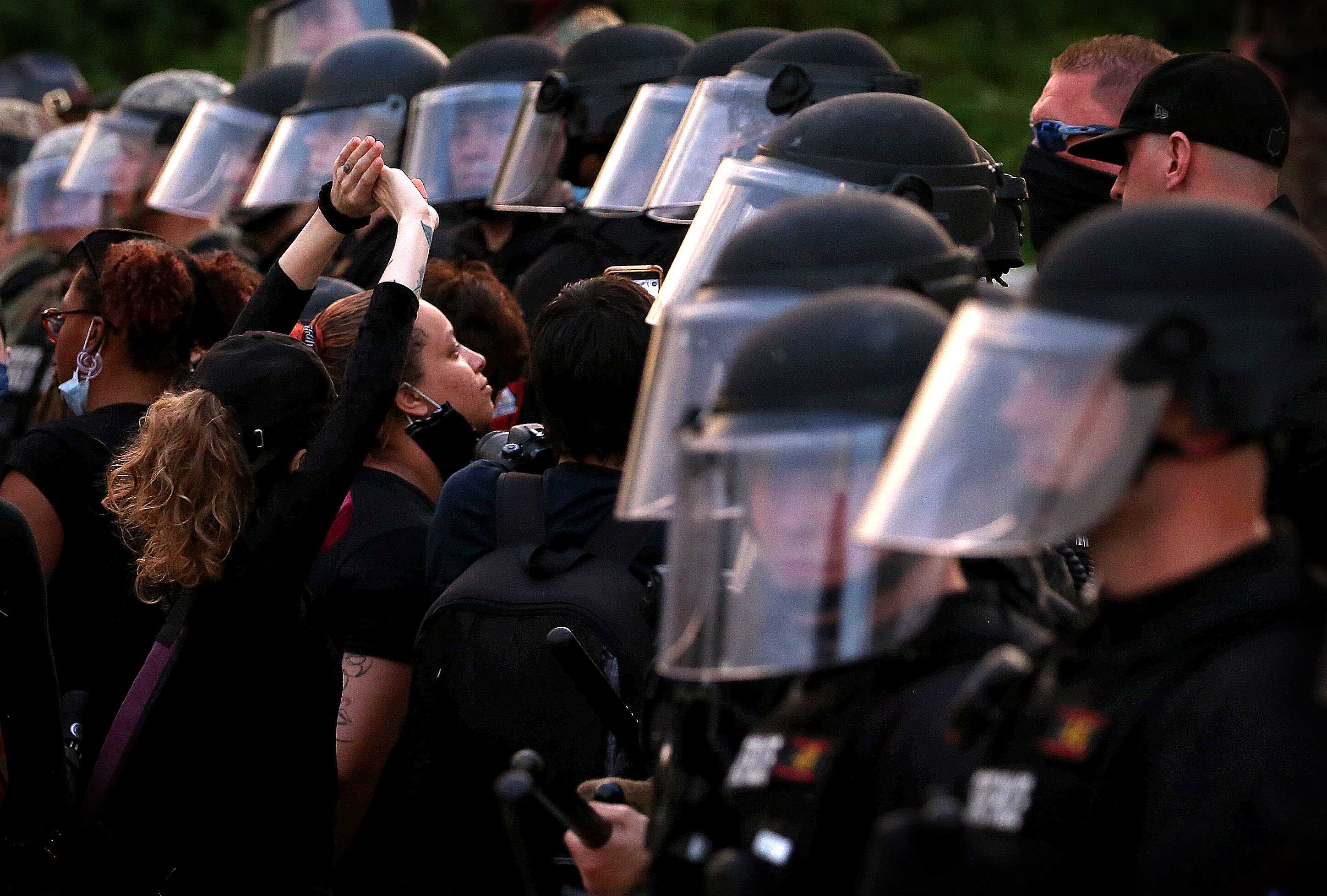 As night fell and the 9pm curfew approached demonstrators confronted RI State Police deployed on the state capital steps.