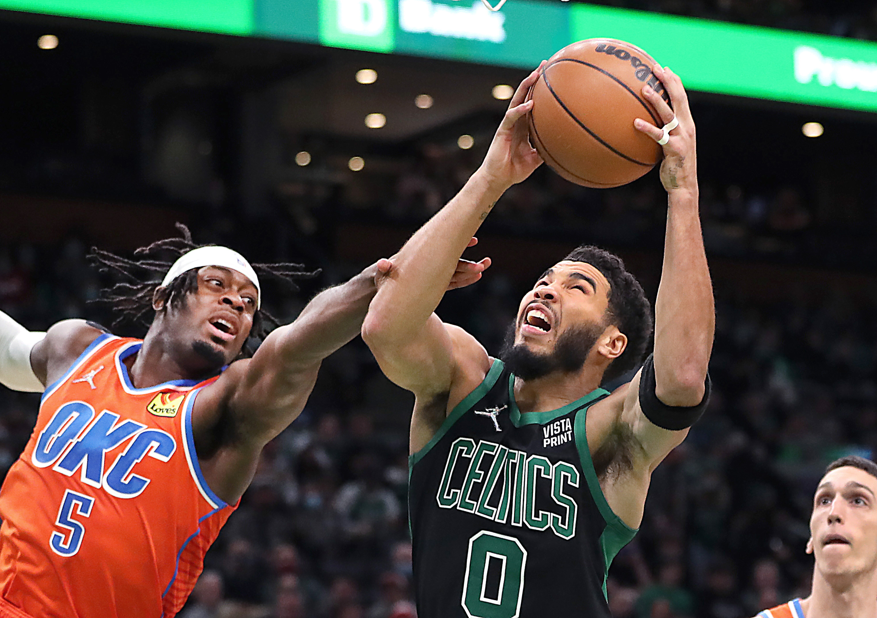 Jayson Tatum drives for 2 of his 33 points in the first quarter against the Thunder.