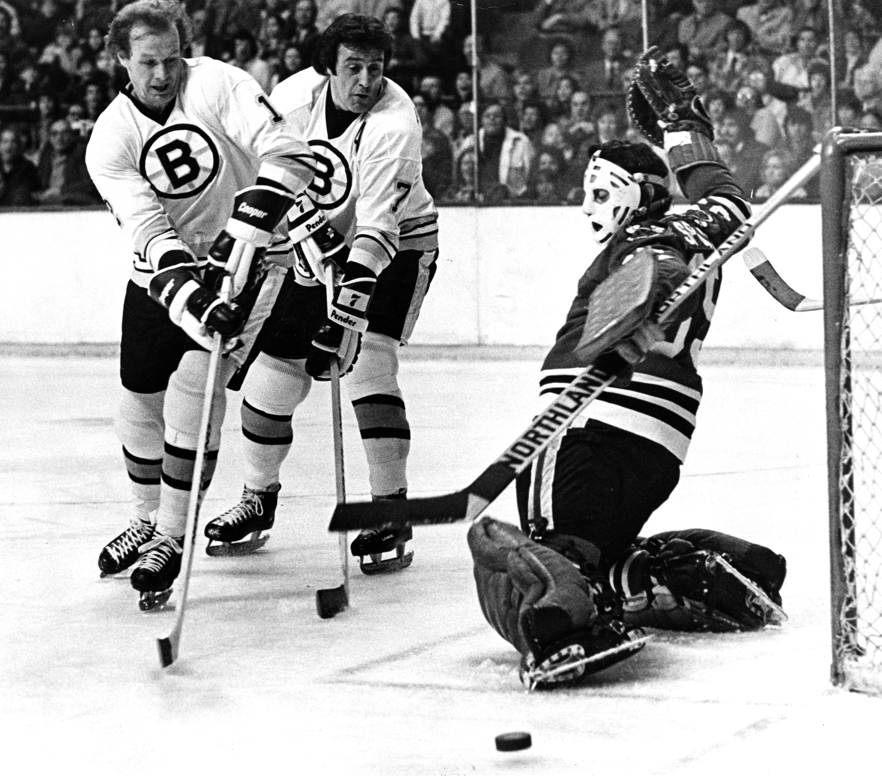Phil Esposito (center) often had to battle his brother Tony (right) in front of the net.