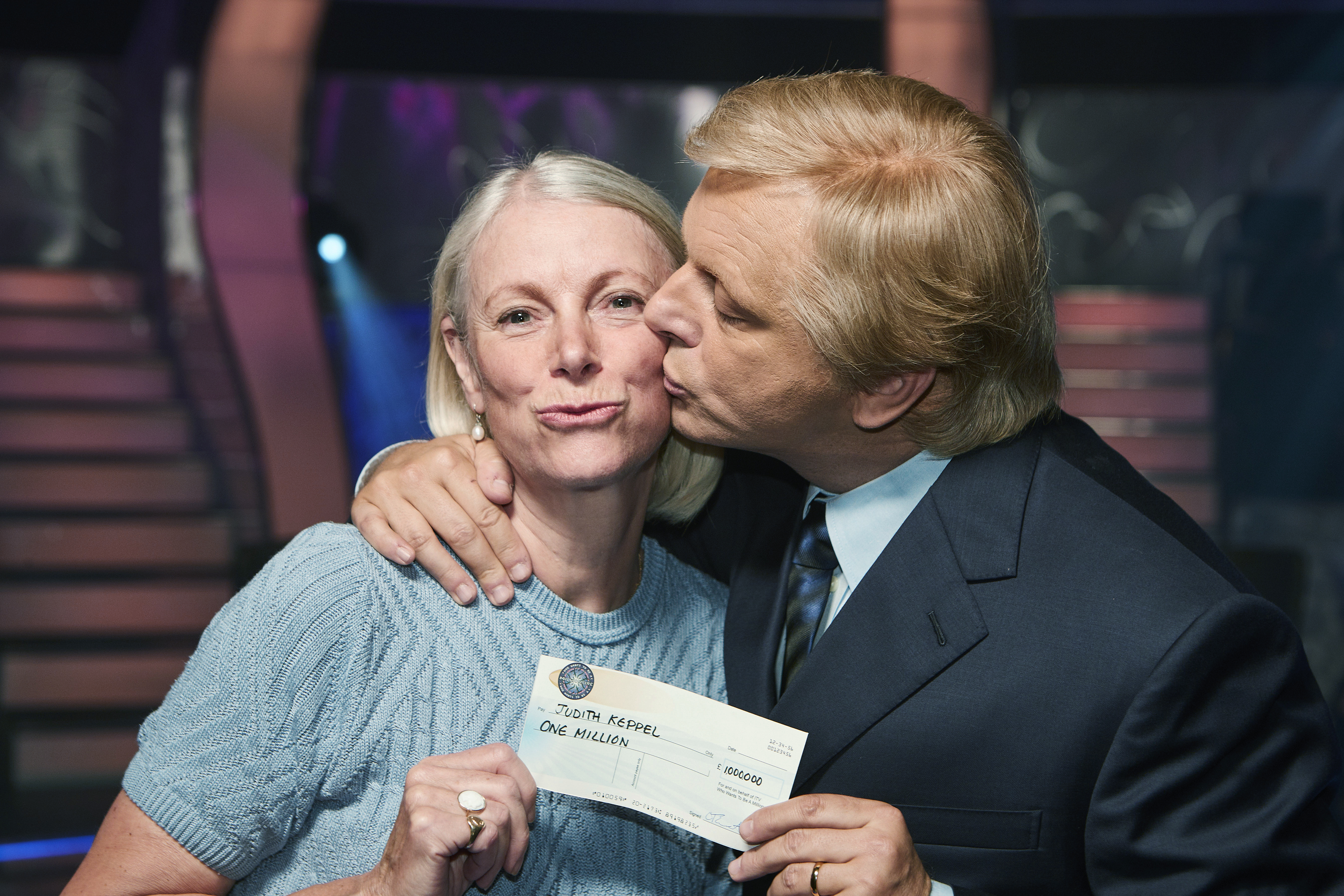 Michael Sheen, as "Who Wants to Be a Millionaire?" host Chris Tarrant, and Judith Keppel in AMC's "Quiz."