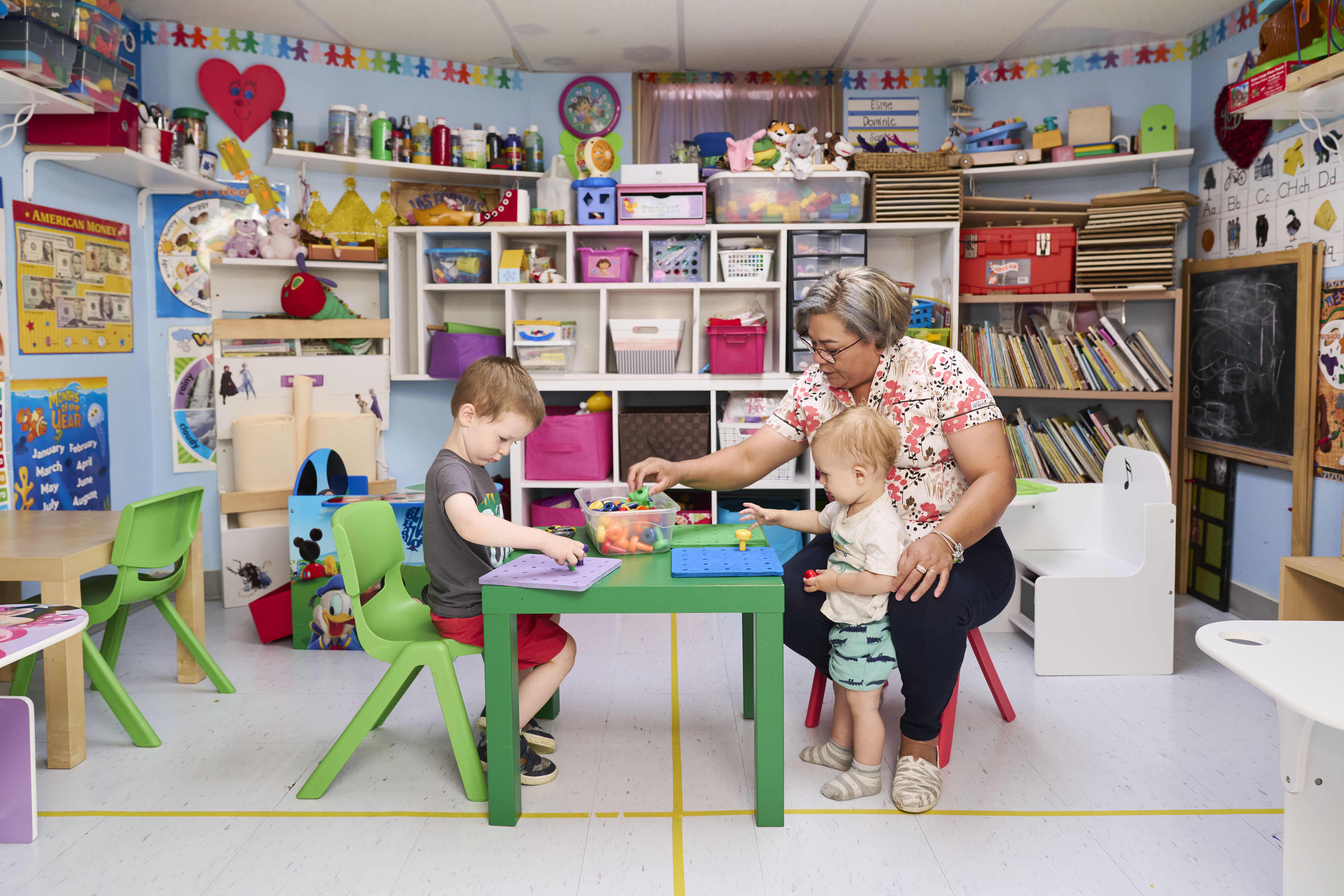 Contreras and children in Gummy Bears’ new home, a space she moved to after needing to sell her house during the pandemic.