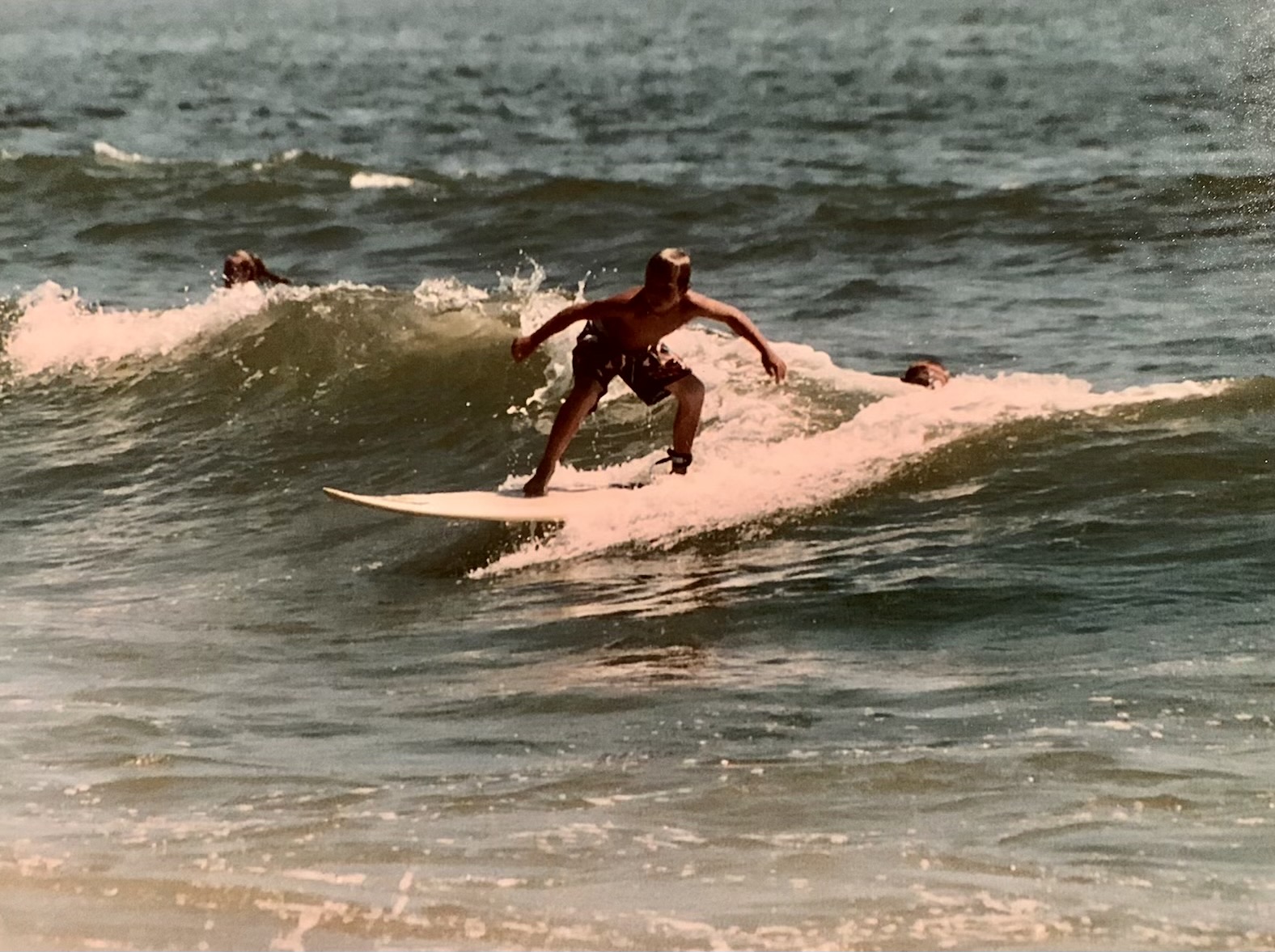 McAvoy is shown surfing at age 8 or 9 off Long Beach in New York.