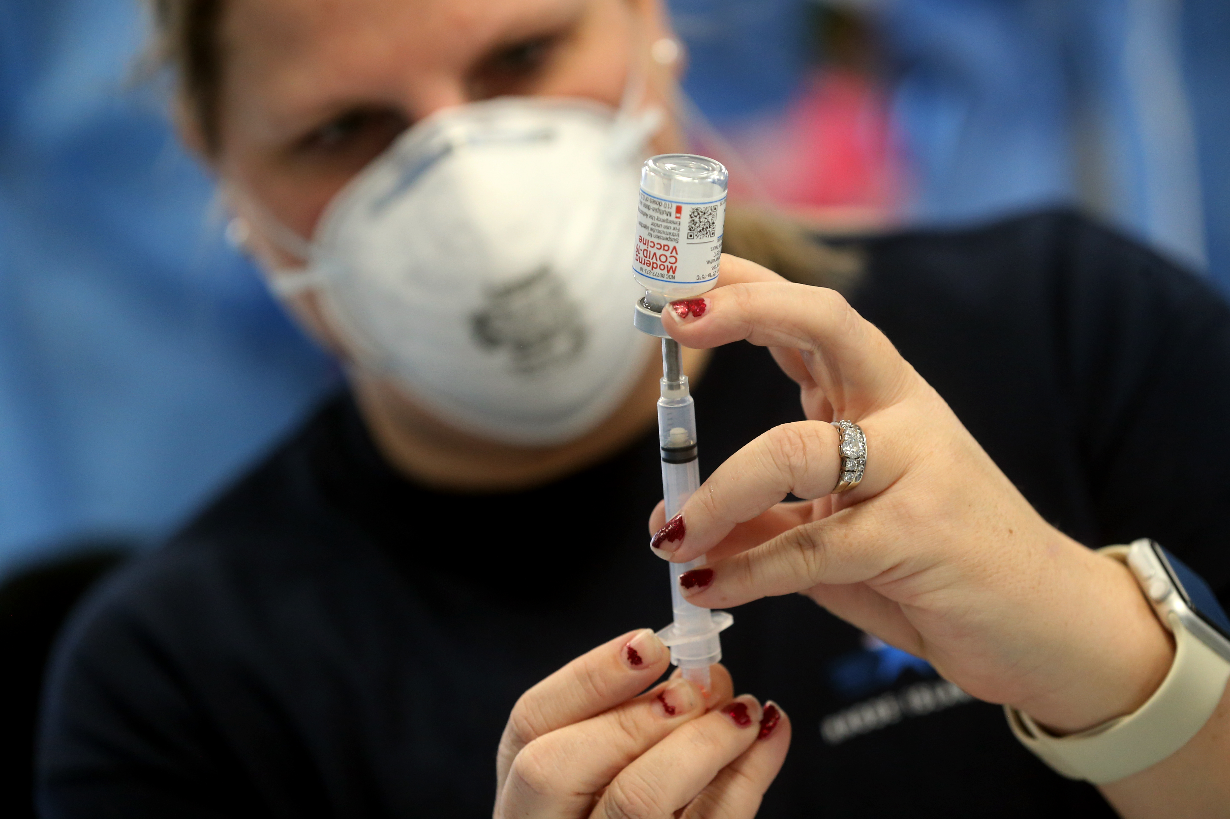 Stephanie Wildenhain prepares doses of the Moderna COVID-19 Vaccine at Forand Manor in Central Falls, Rhode Island.