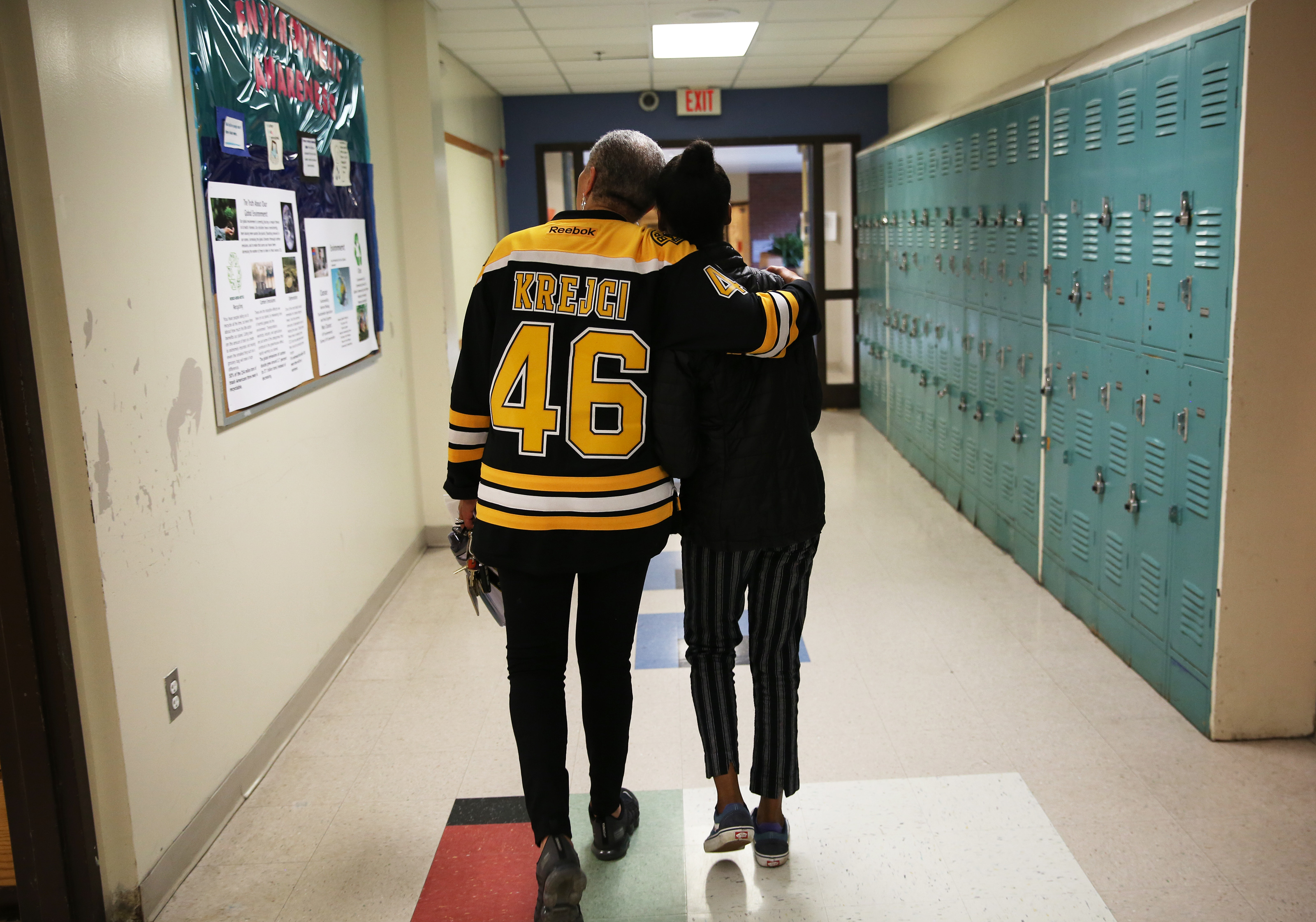 Jada Pierre (right) walked with Katani Sumner, a Metco counselor at Newton South, as Jada stayed after school to work on homework. Earlier in the day, Sumner told Jada that the school would be starting a new program to go to Ghana.