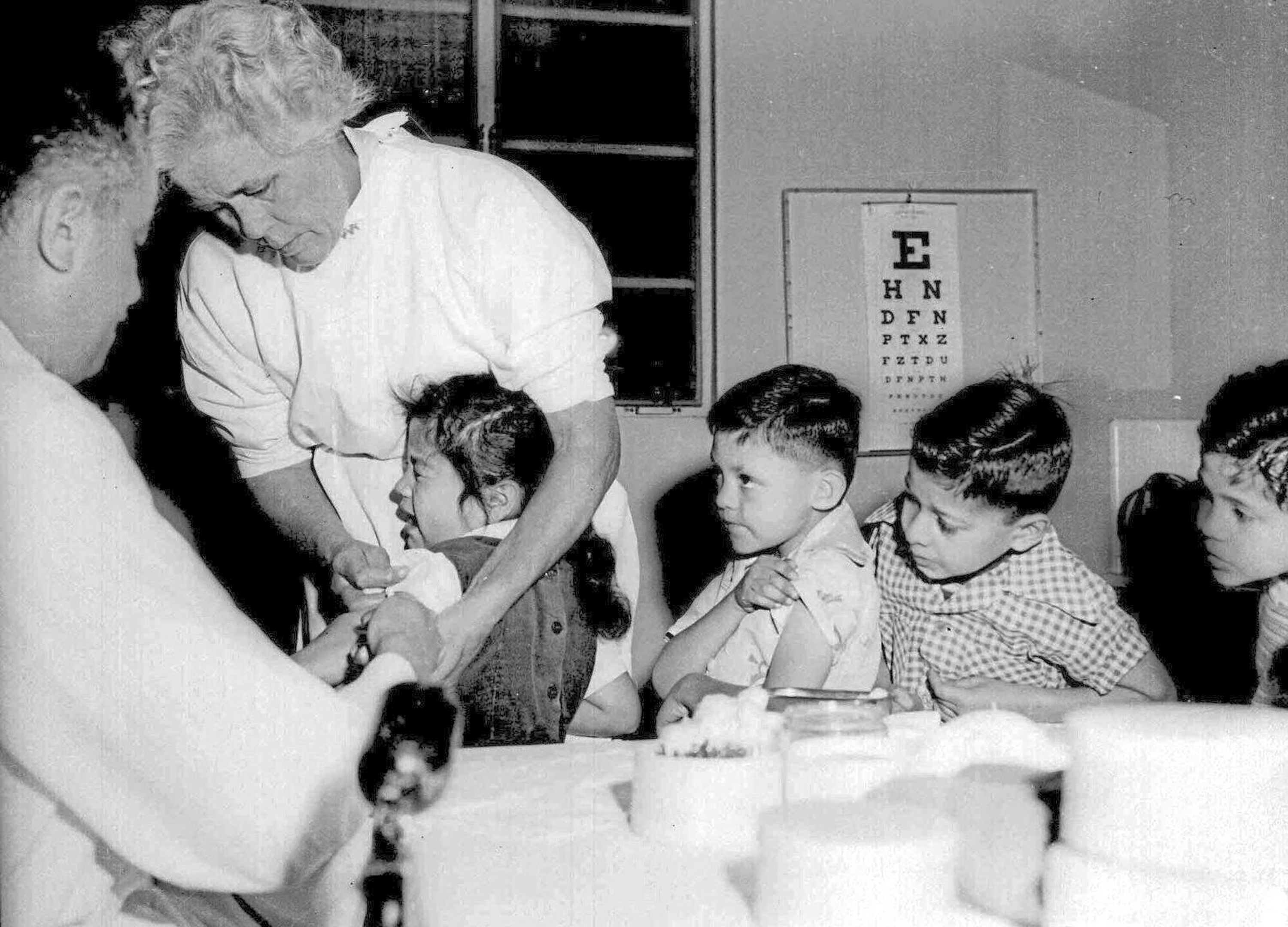 April 1955: First- and second-graders at St. Vibiana's school are inoculated against polio with the Salk vaccine in Los Angeles. Polio was eradicated in the United States in 1979.