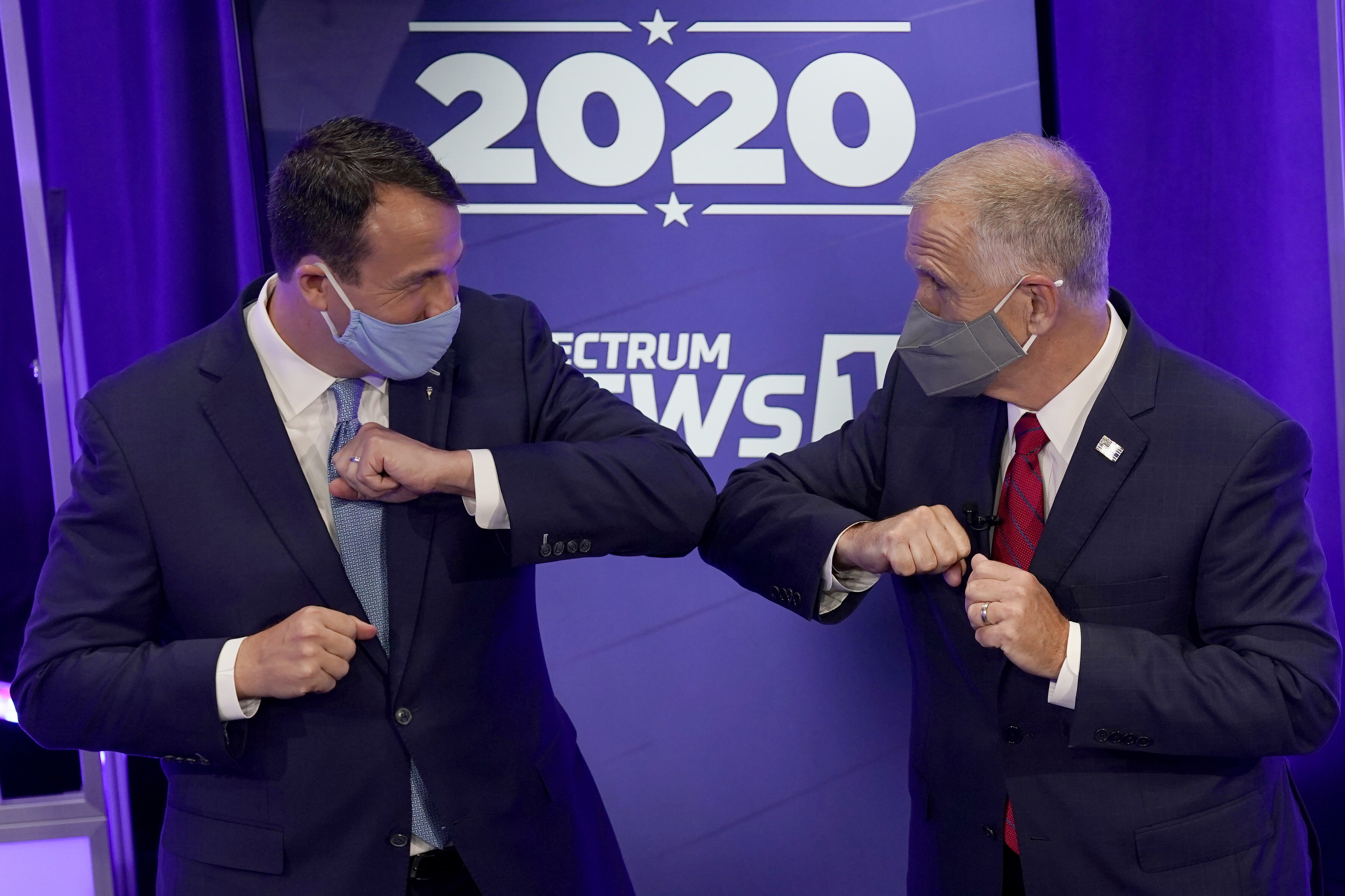 Democratic challenger Cal Cunningham (left) and US Senator Thom Tillis greet each other after a televised debate on Oct. 1.