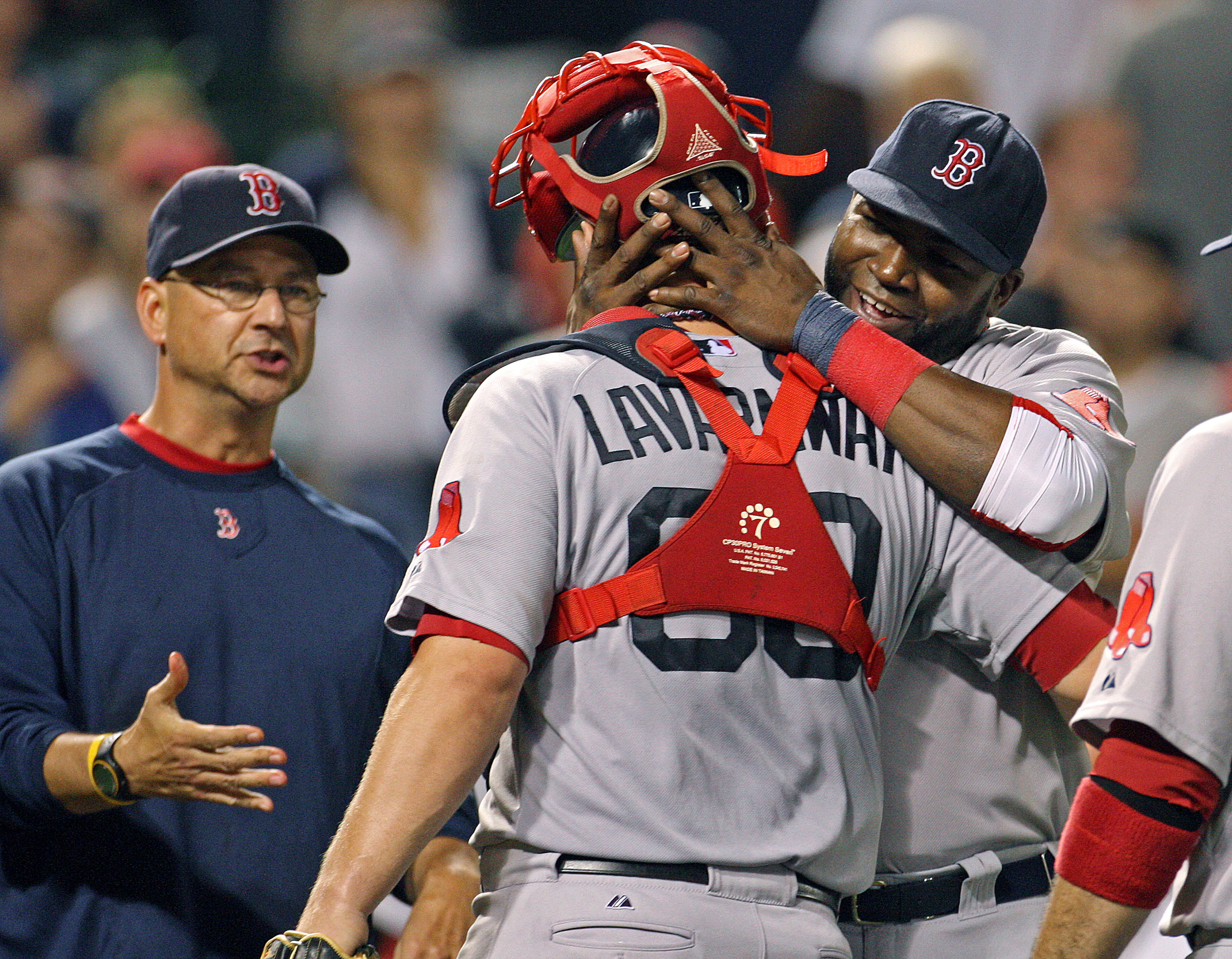 Red Sox catcher Ryan Lavarnway hugs Ortiz (as manager Terry Francona stands nearby) after a rare win Sept. 27. The Sox won just seven times that month.