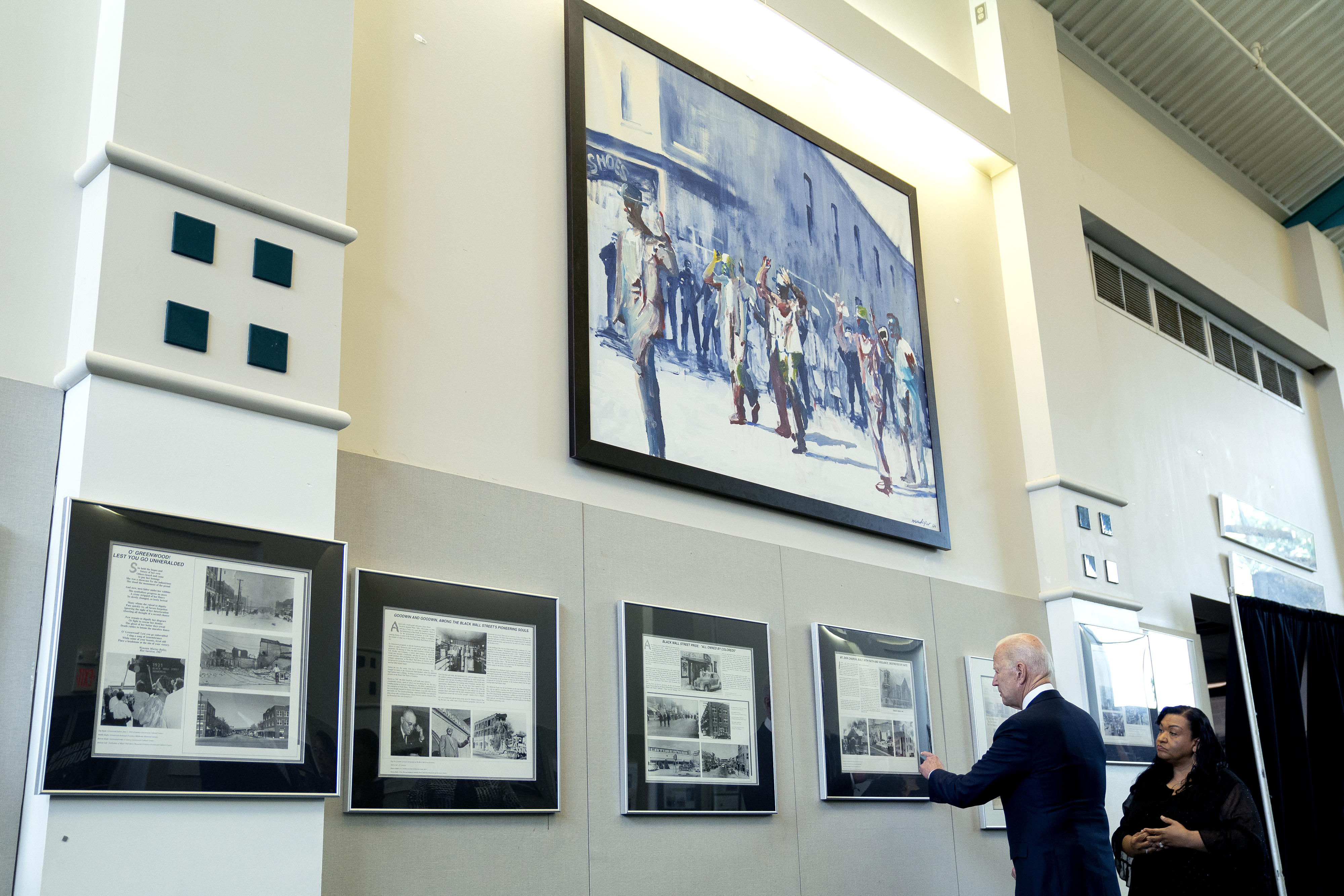 President Biden inspected a display at the Greenwood Cultural Center in Tulsa, Okla., on Tuesday.