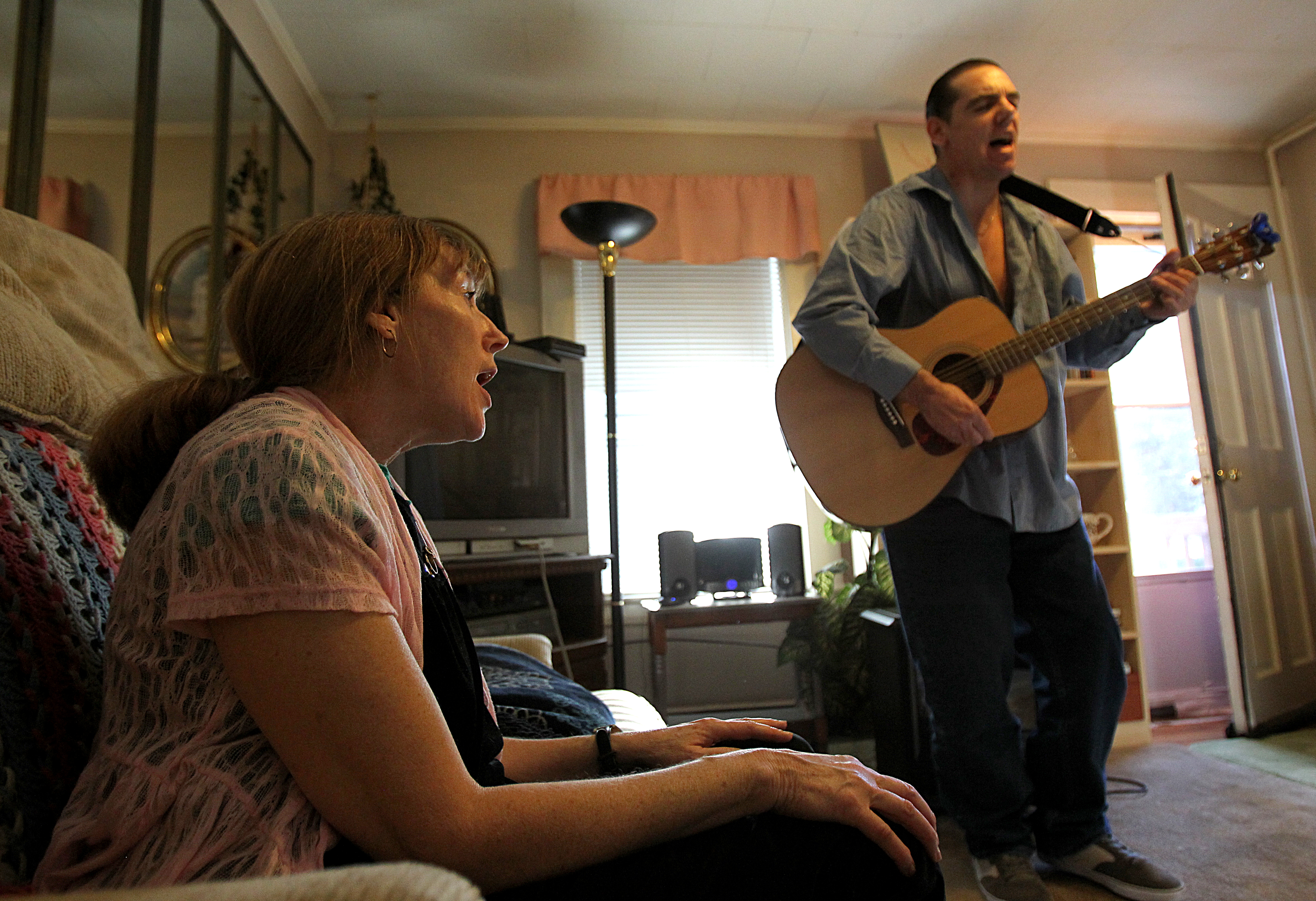 When Mike got home from Worcester, one of the first things he did was play his guitar. Peggy swayed and sang along to the songs she knew.