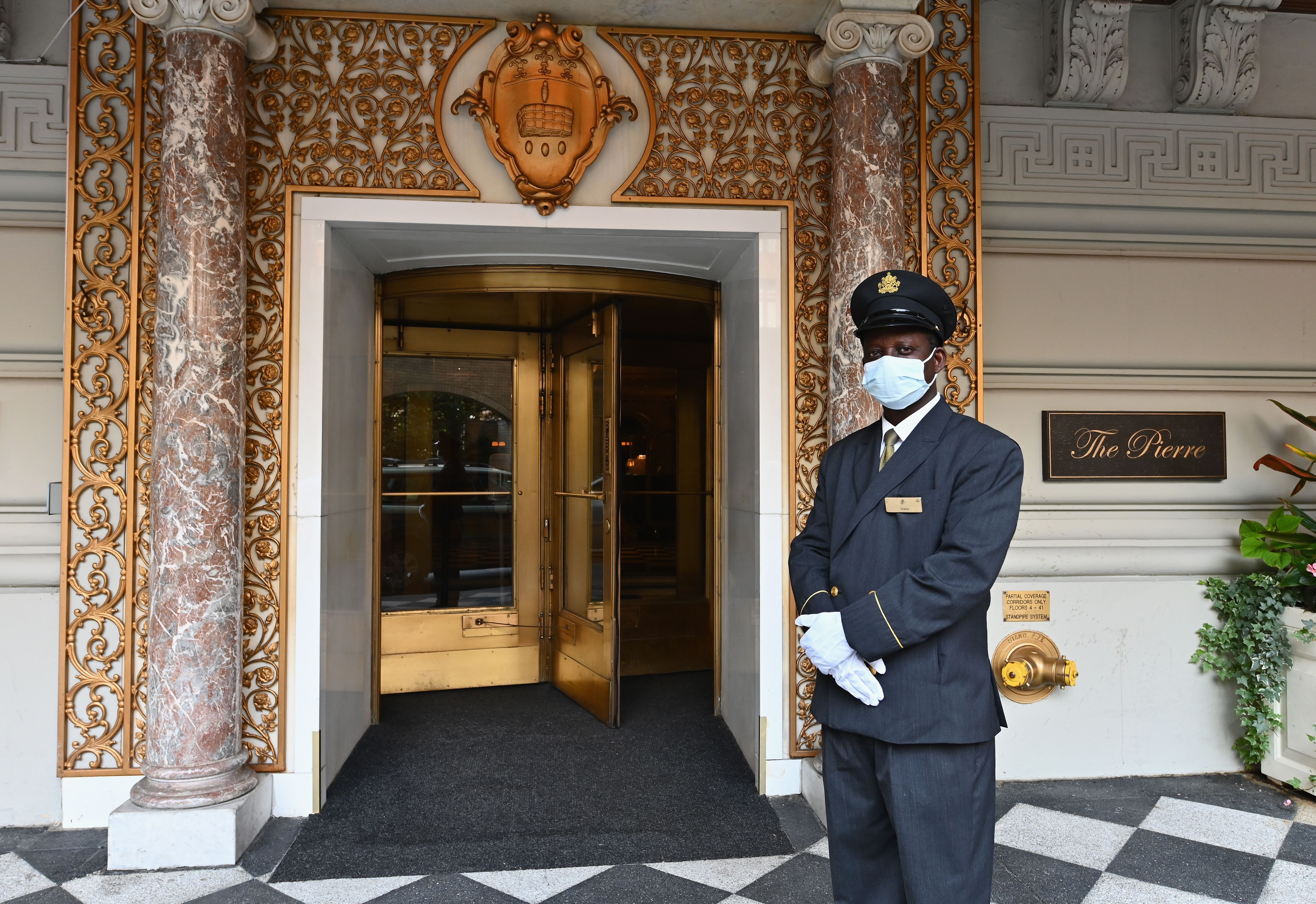 Doorman Isaac stands at the entrance to The Pierre, A Taj Hotel, New York in September 2020.