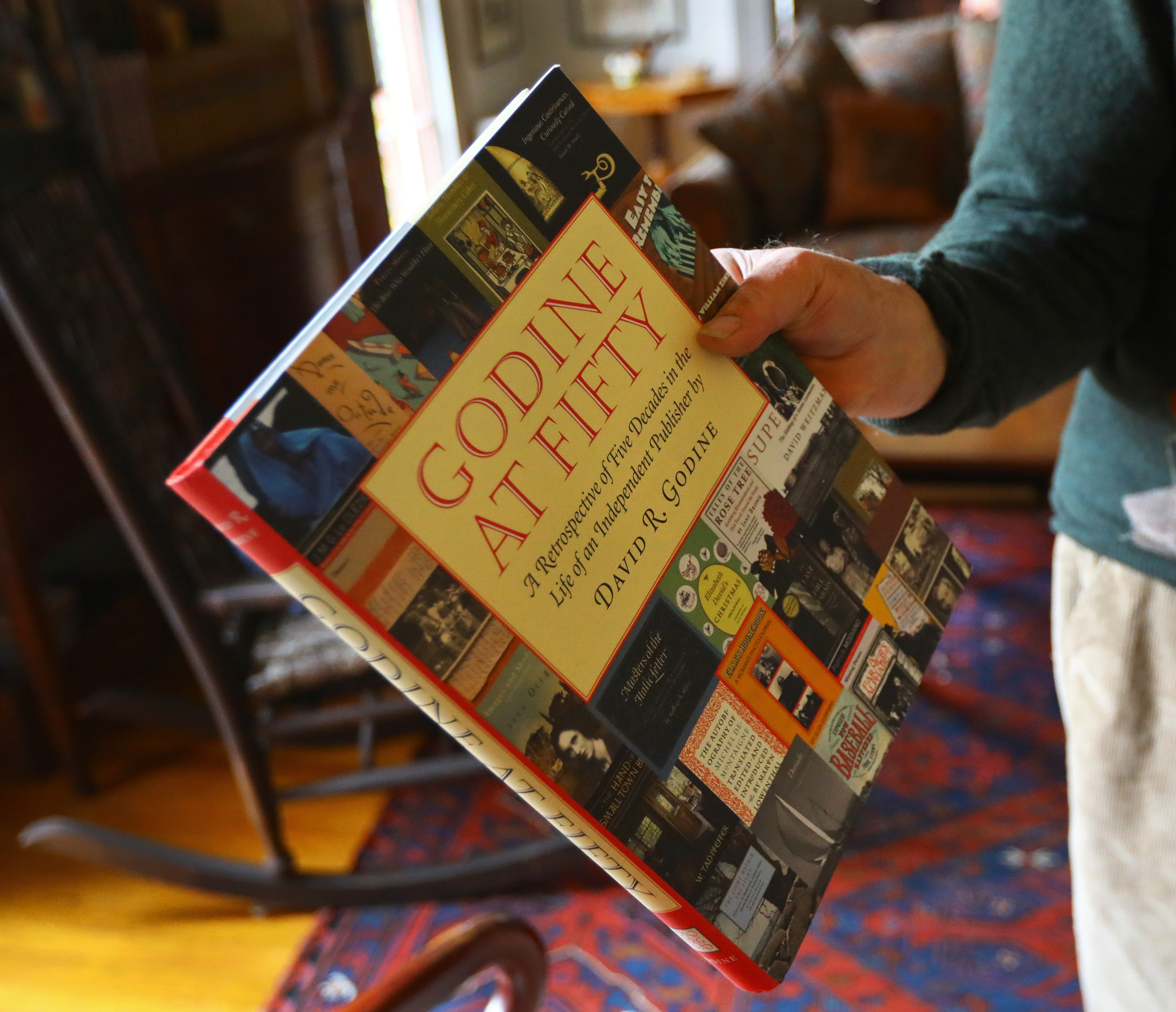 David Godine holds a copy of “Godine at Fifty.”