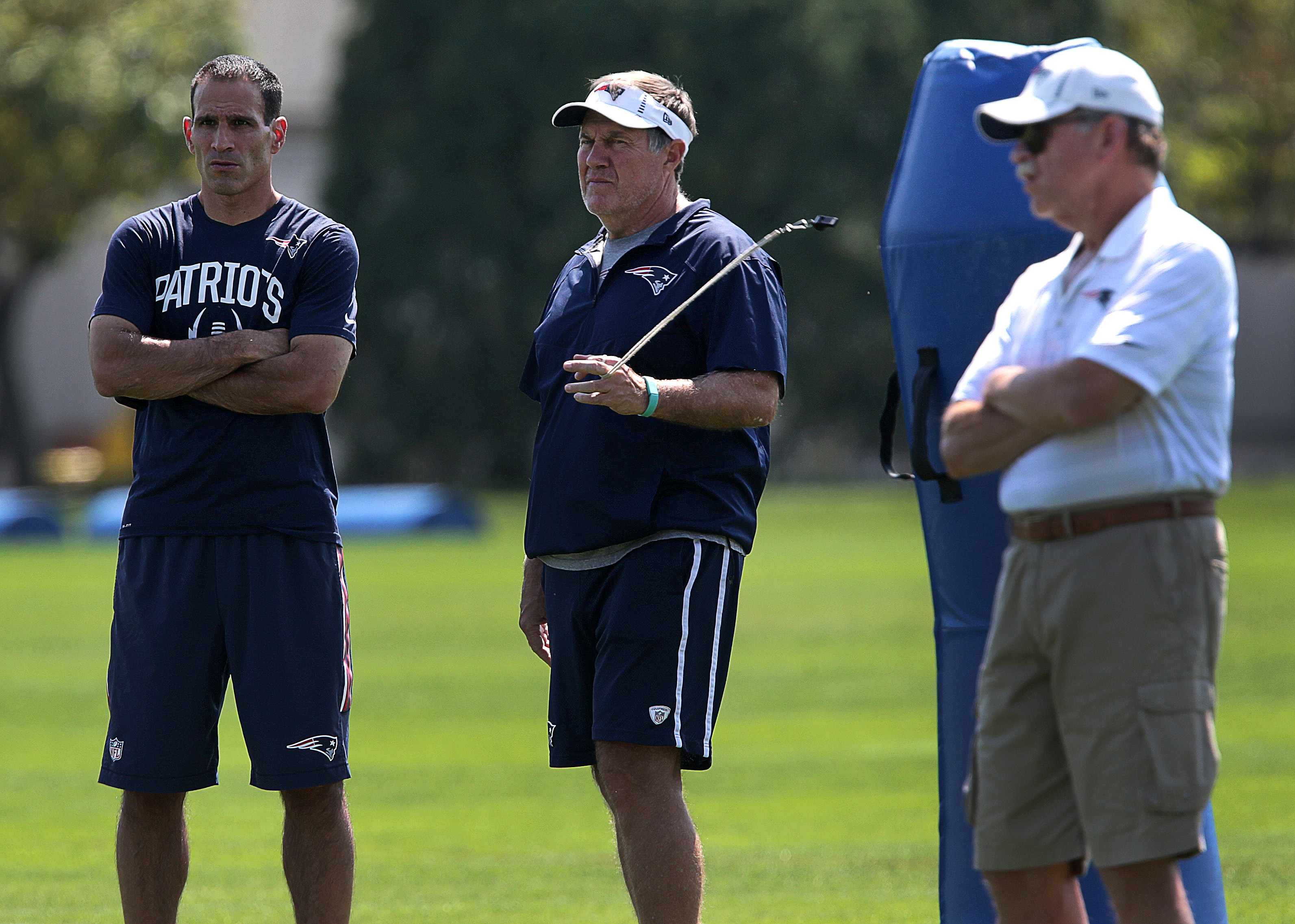 Berj Najarian and Bill Belichick watch a 2015 practice.