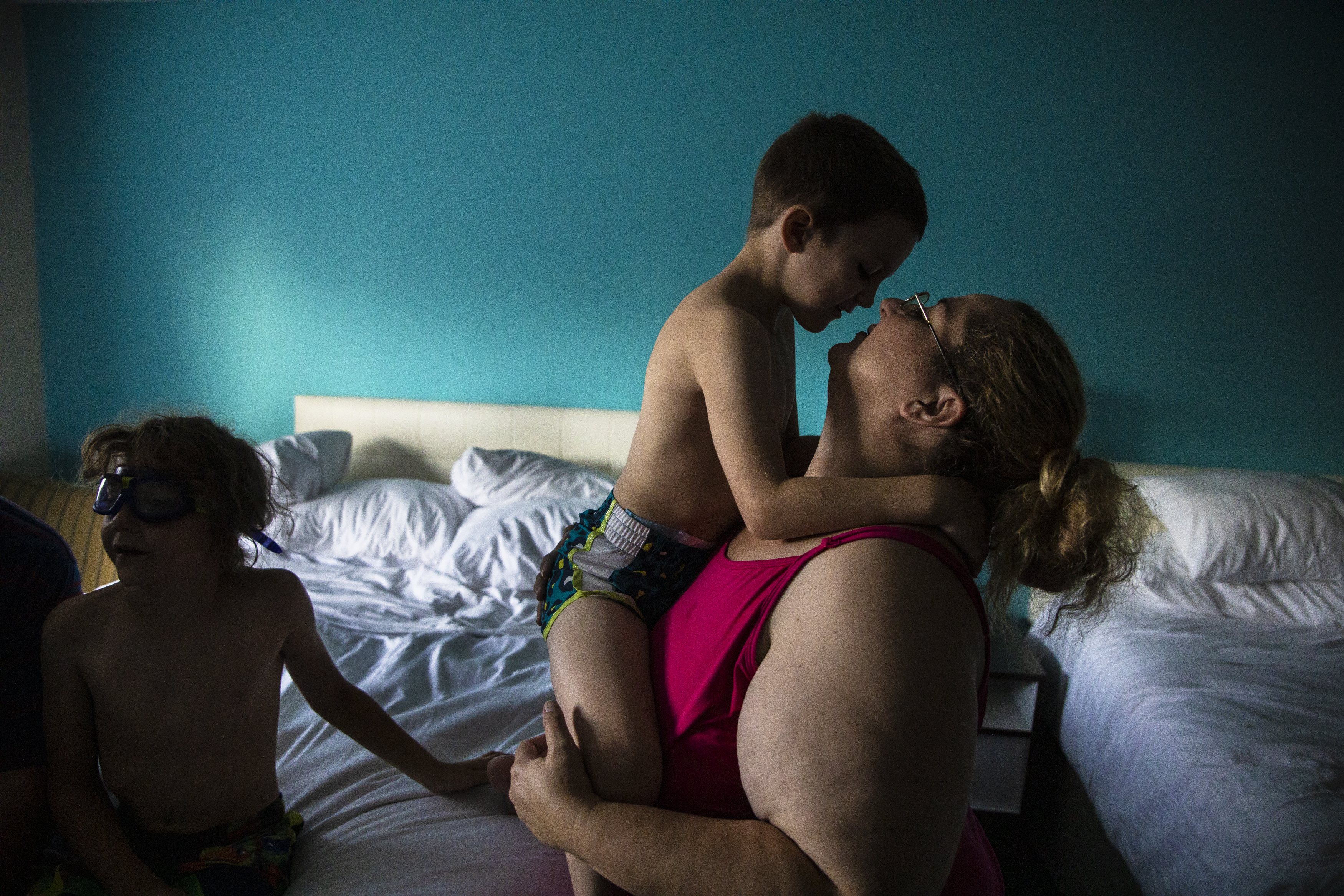 Mariah picks up her son Dylan and holds him close while spending a night at a hotel in Portland paid for by their case manager. Earlier in the day, the Lupiens packed up their tent for good after spending over a month living in campgrounds. After threats from DHHS to have their children taken from them due to unsuitable living conditions, Mariah and her husband chose to move the family to New Hampshire after finally being accepted to a homeless shelter. The decision was a hard one to make, as it would mean leaving Patrick’s job and important services for the children behind. But it meant keeping the family together, which was their number one priority.