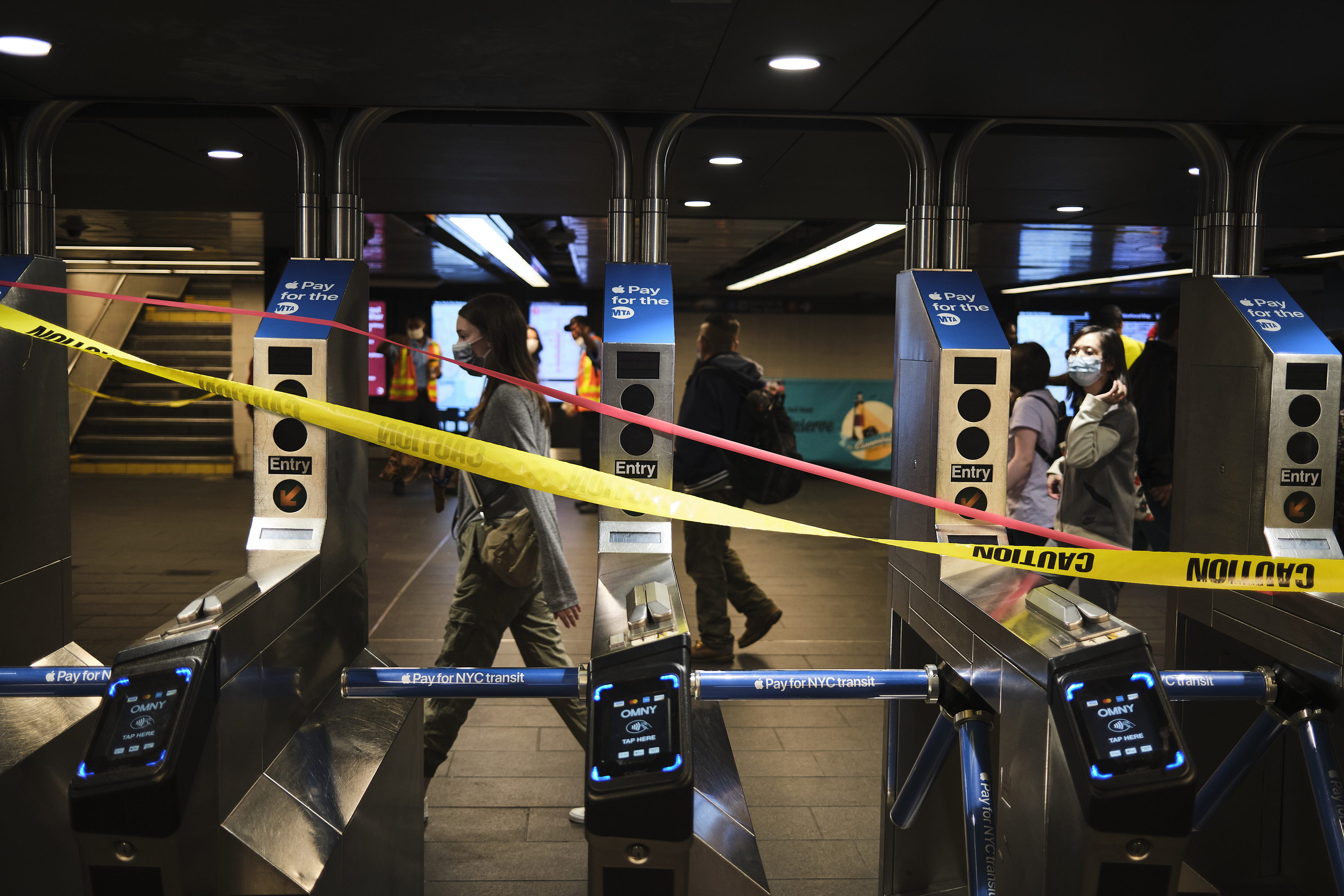 Commuters walked past a closed entrance at Penn Station in New York on Thursday.
