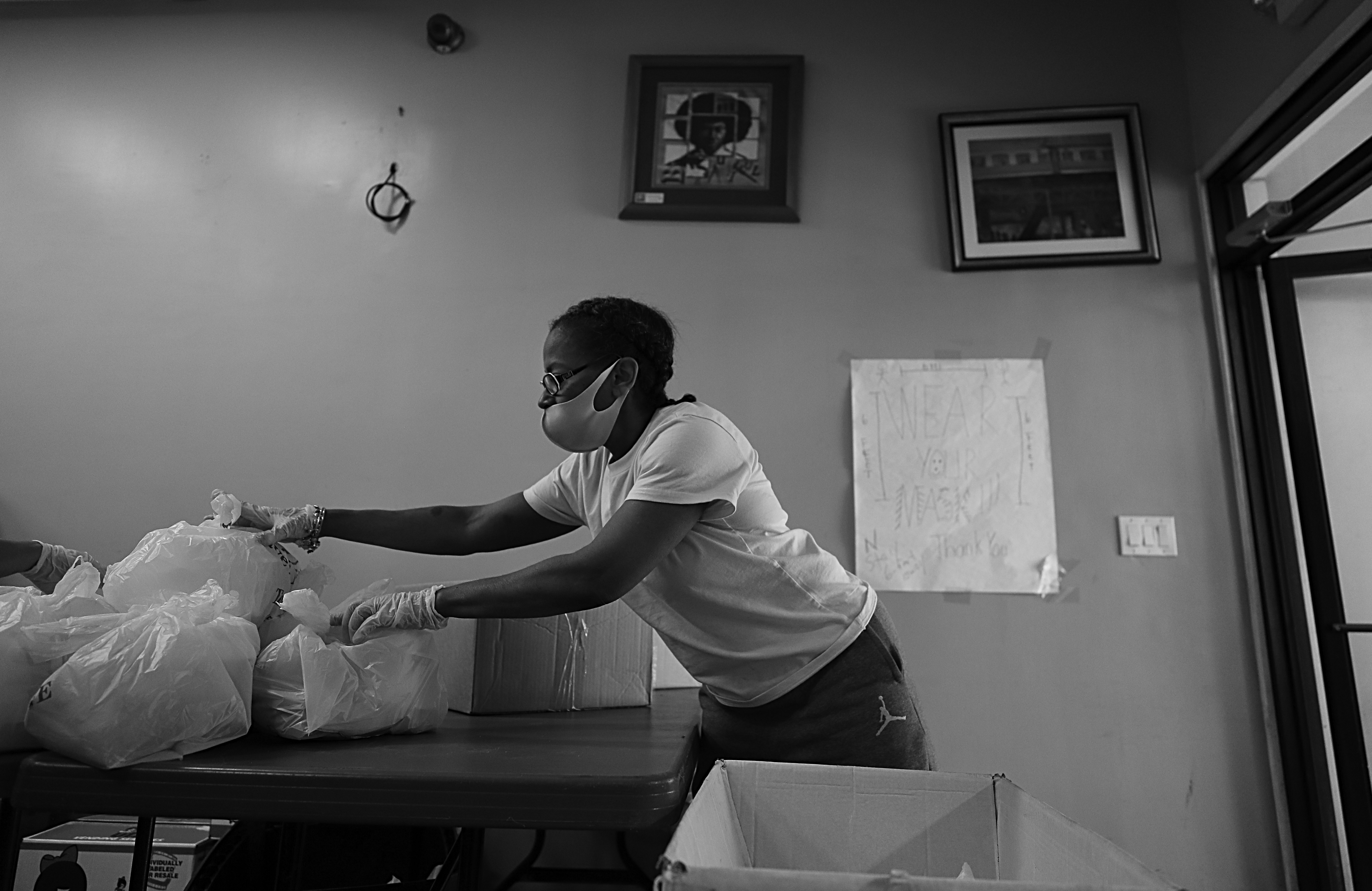 Erika Hendricks lost her bartending job during the coronavirus pandemic. She spends her days volunteering at the Food for the Soul restaurant making meals for those in need. She kept track of the bundles of meals for the volunteer drivers.
