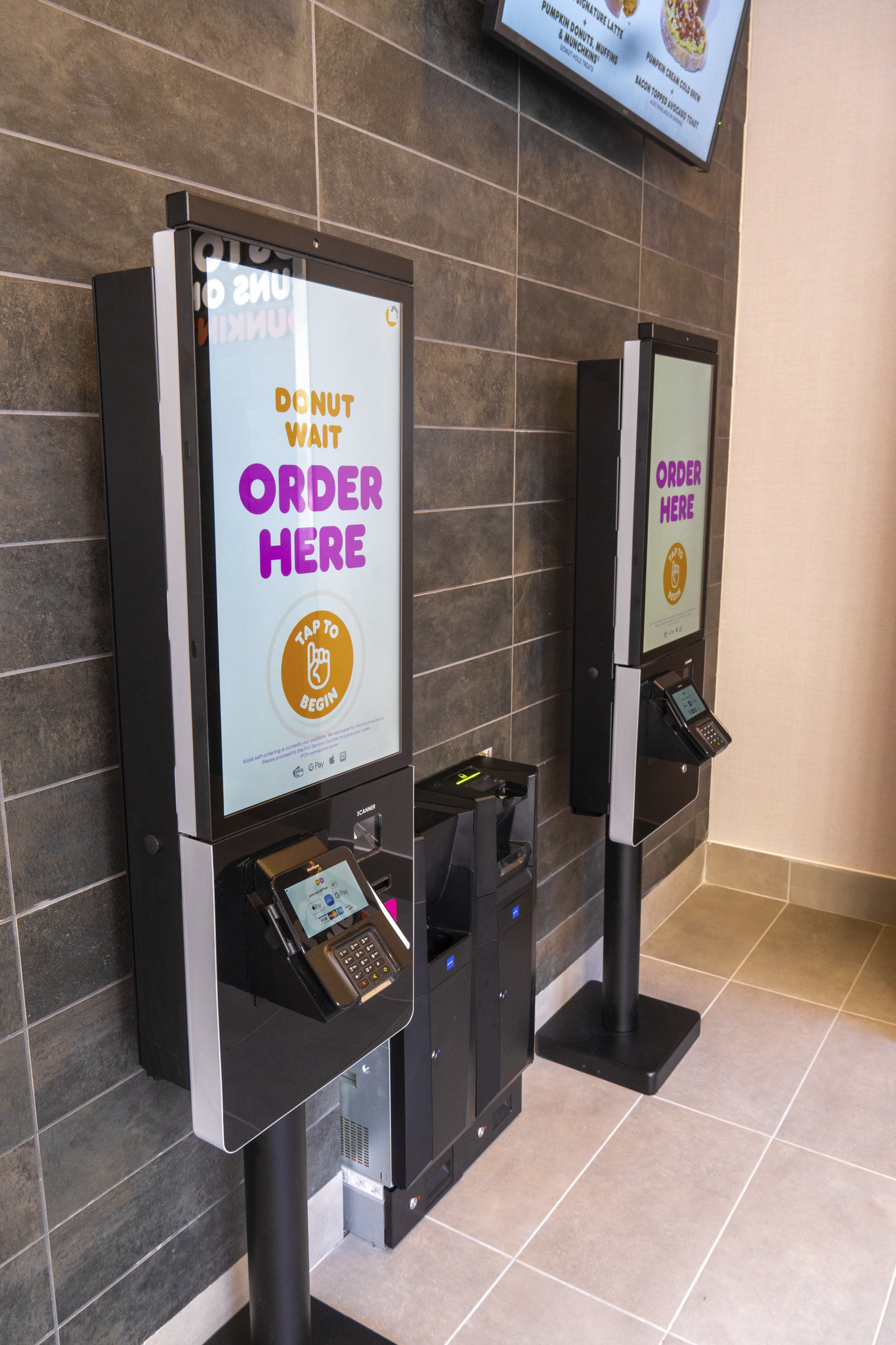 The order kiosks at the Beacon Street Dunkin' Digital store.