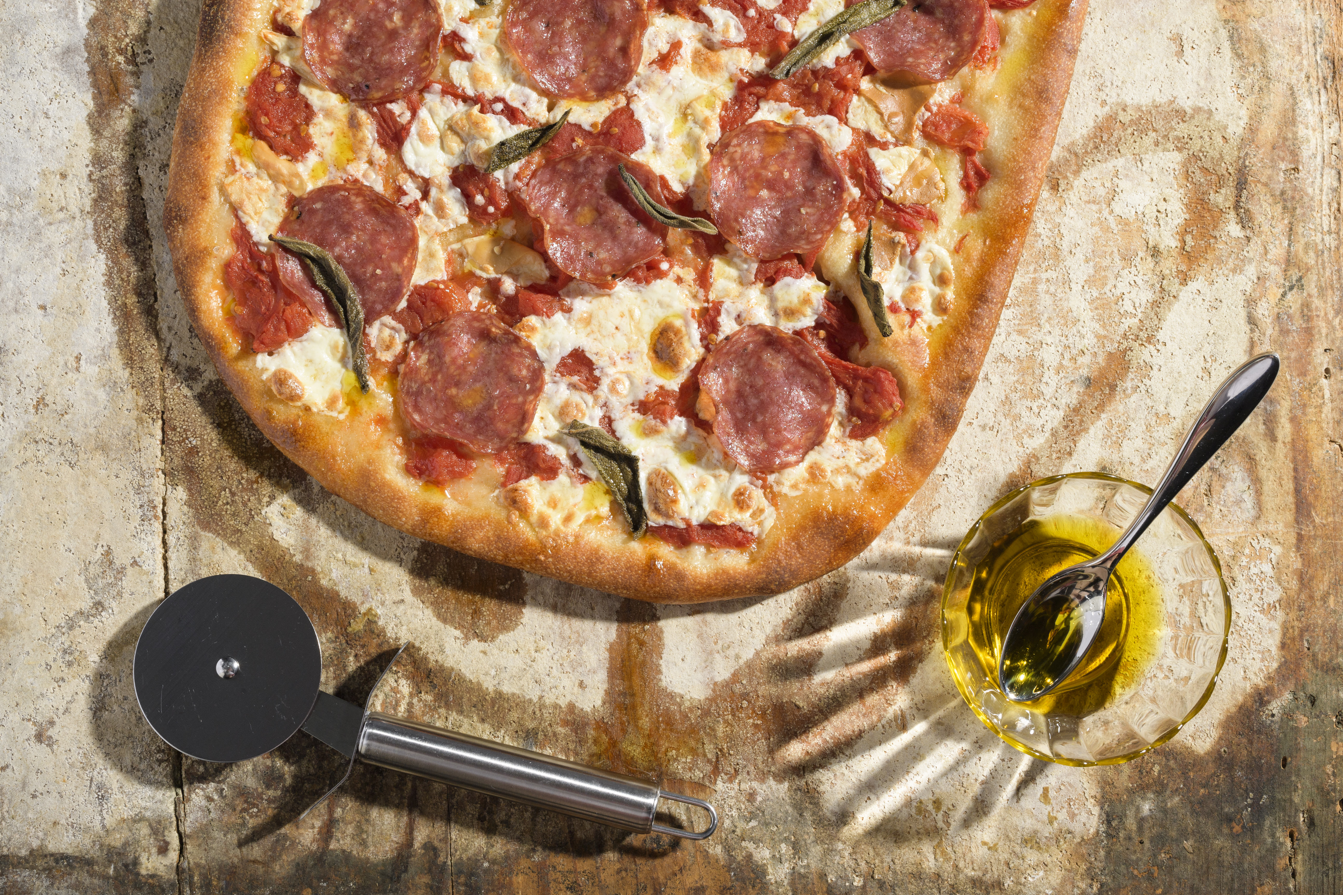 Pizza With Salami and Smoked Mozzarella.