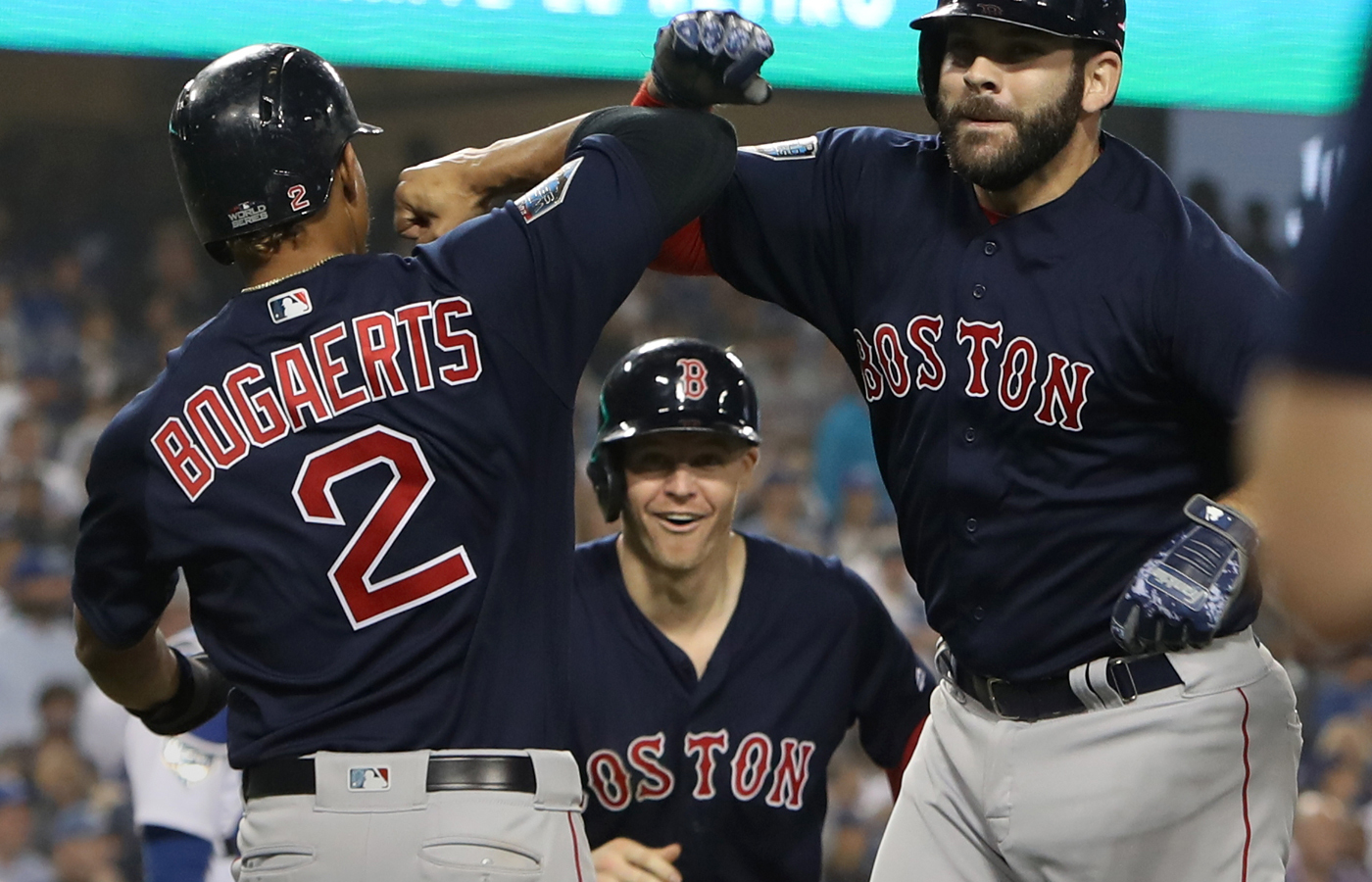 Mitch Moreland celebrates with Xander Bogaerts and Brock Holt after Moreland's memorable homer in the 2018 World Series.