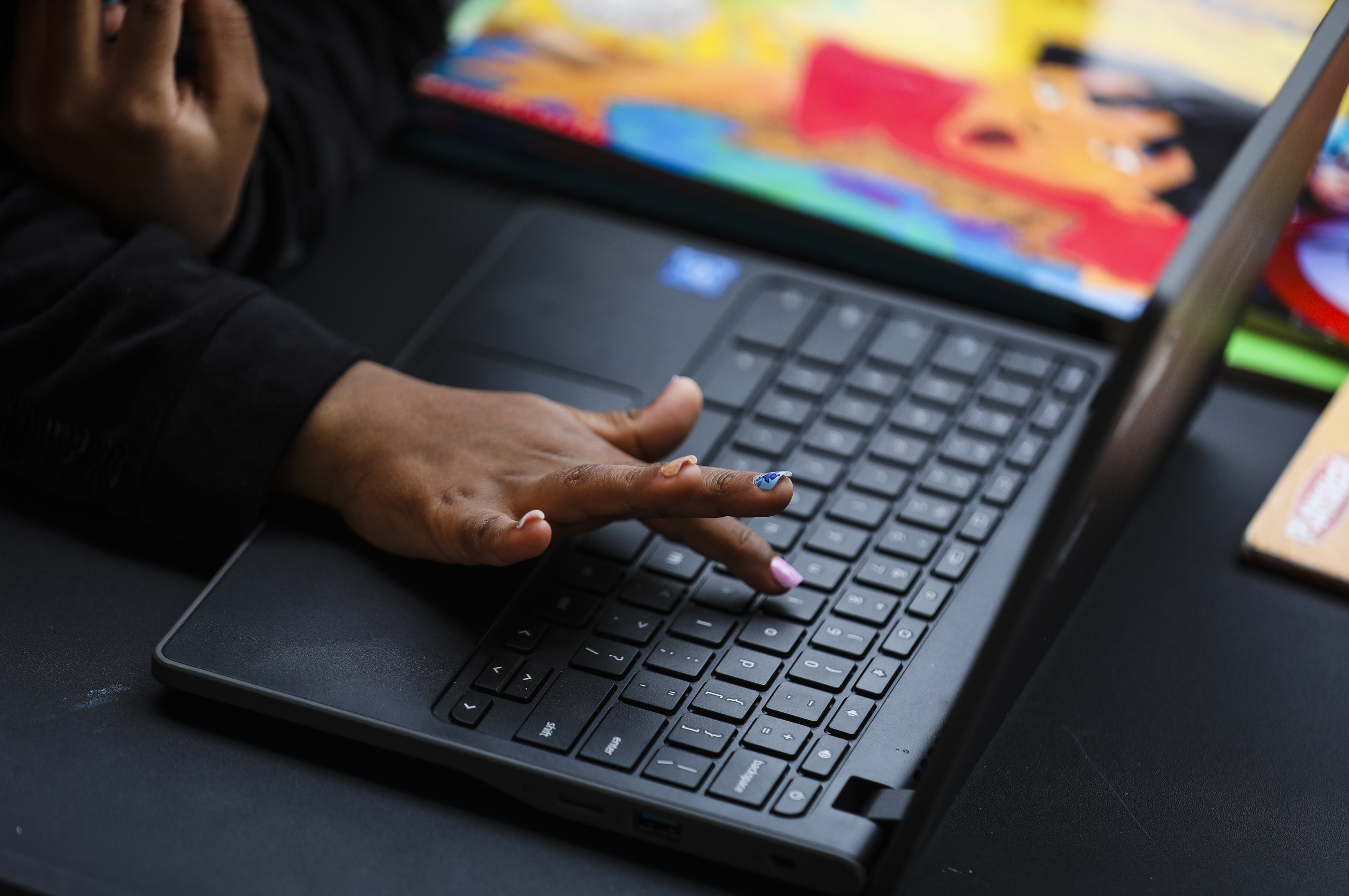 Angelys Hidalgo, 5, learned how to find a letter on the keyboard while working on her pre-K schoolwork last Wednesday afternoon. The Hidalgo family is just one of many dealing with online classes because of school closures and the issues that high-speed Internet access bring to many students trying to get their work done.