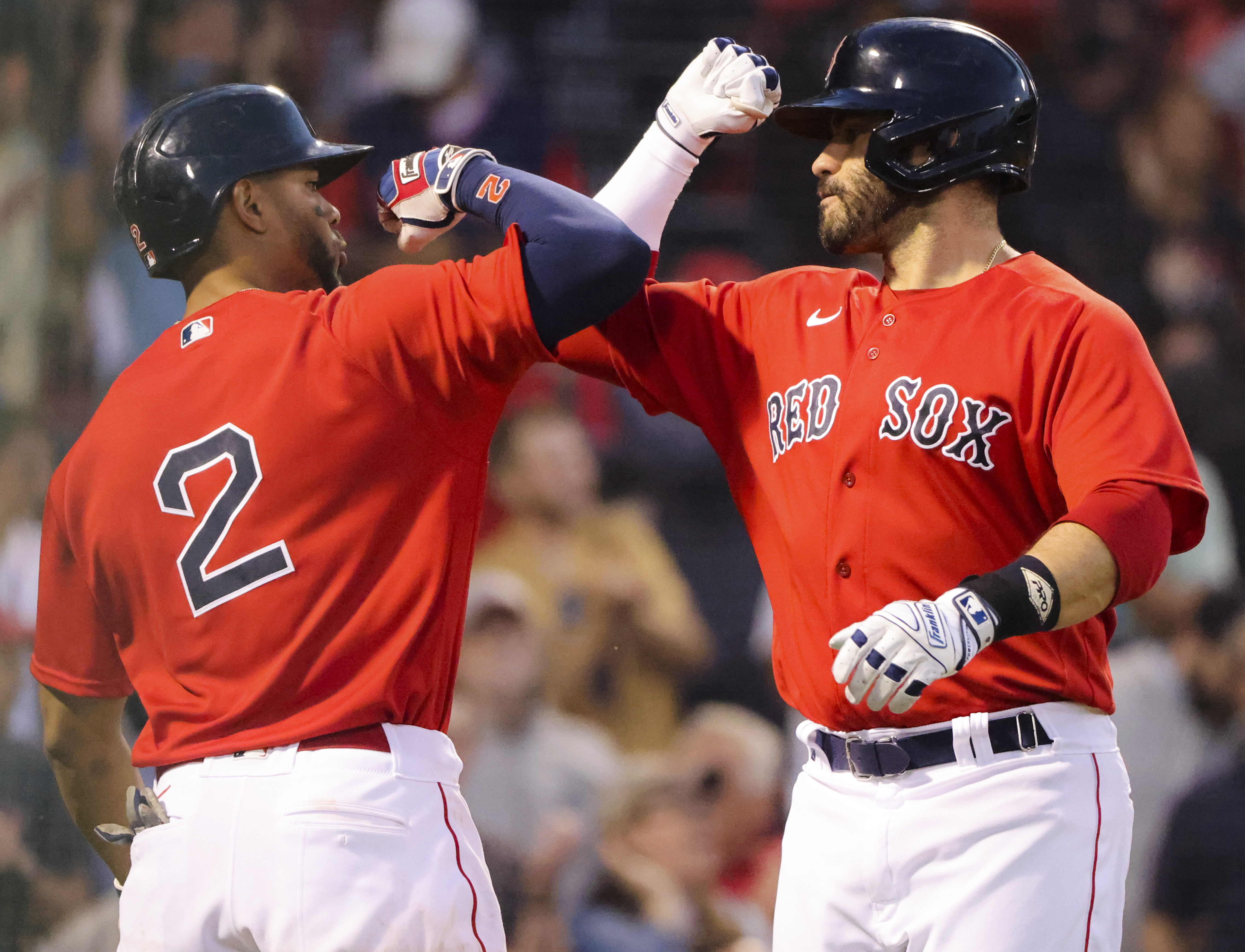 J.D. Martinez celebrates his solo homer with Xander Bogaerts in the third inning of Thursday's game.
