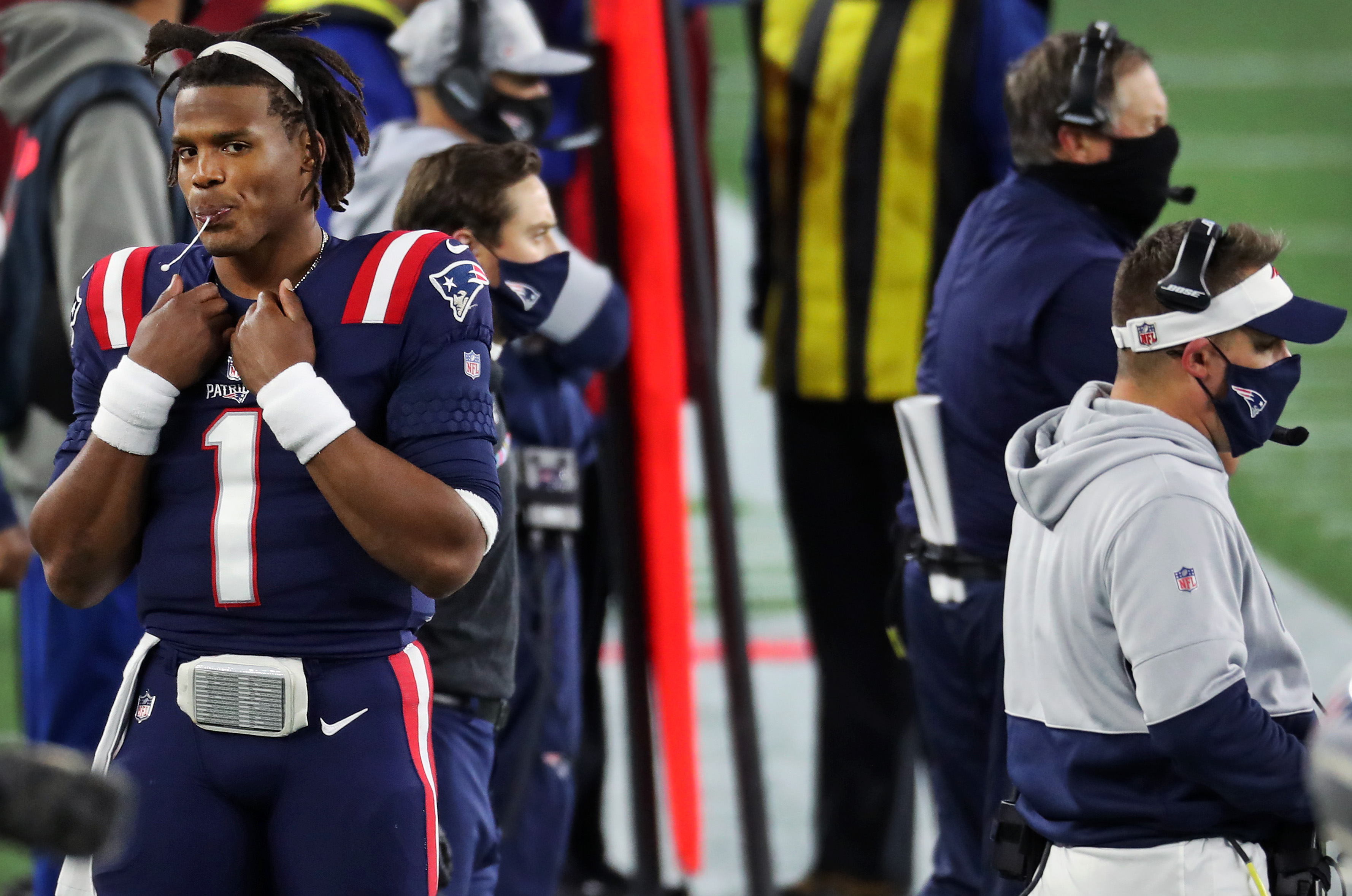 Cam Newton (1) is pictured on the sidelines in the second half of Sunday's loss.