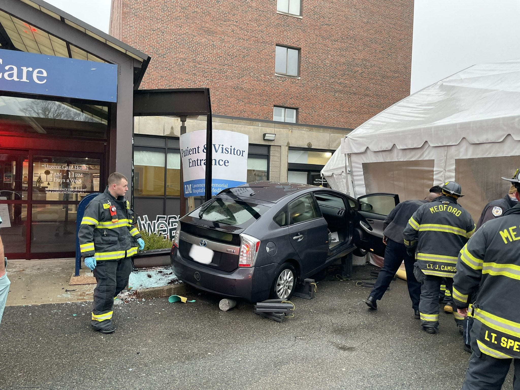 Driver accidentally crashes car into testing site outside Medford hospital  - The Boston Globe