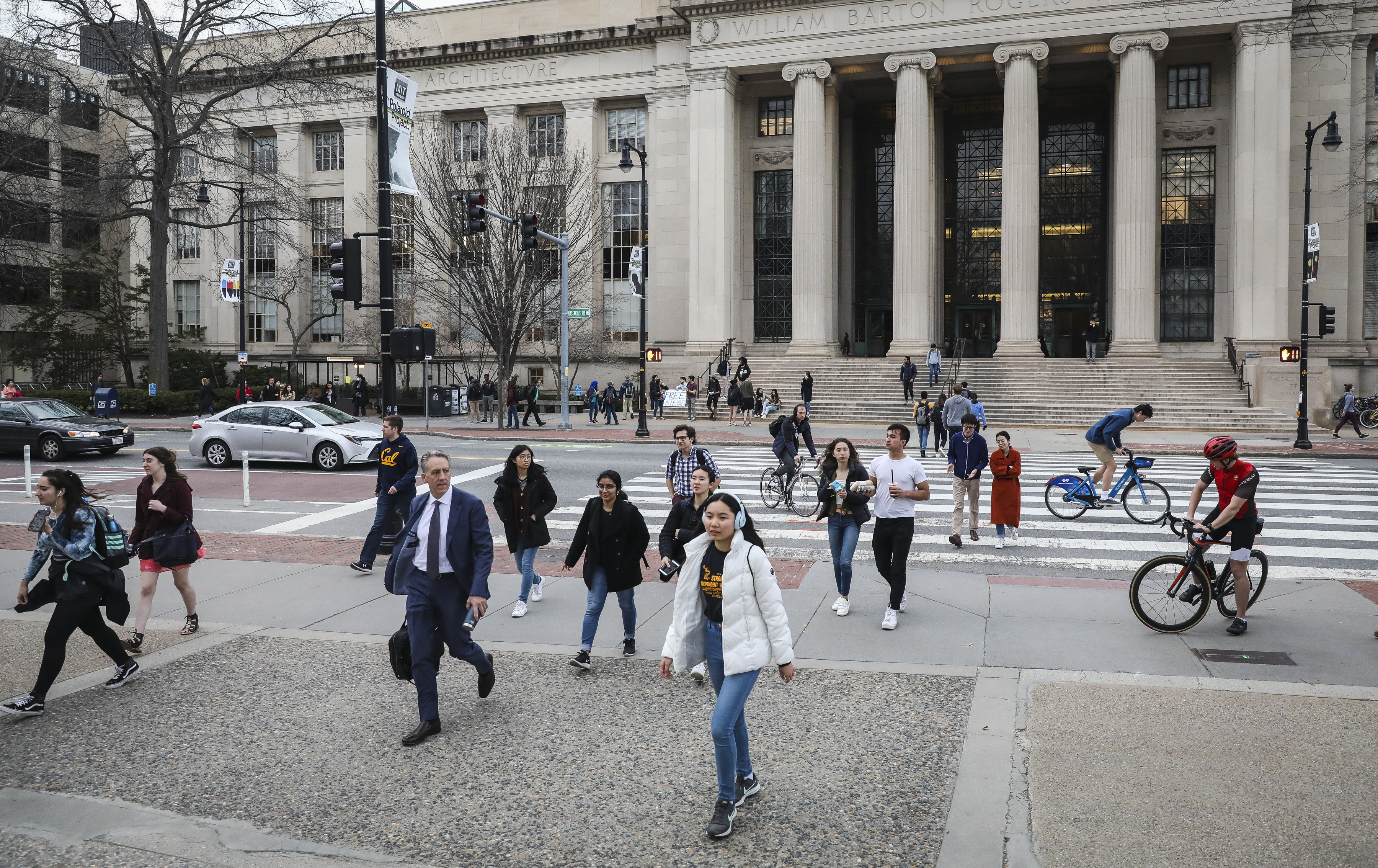 Students walk across campus at MIT.