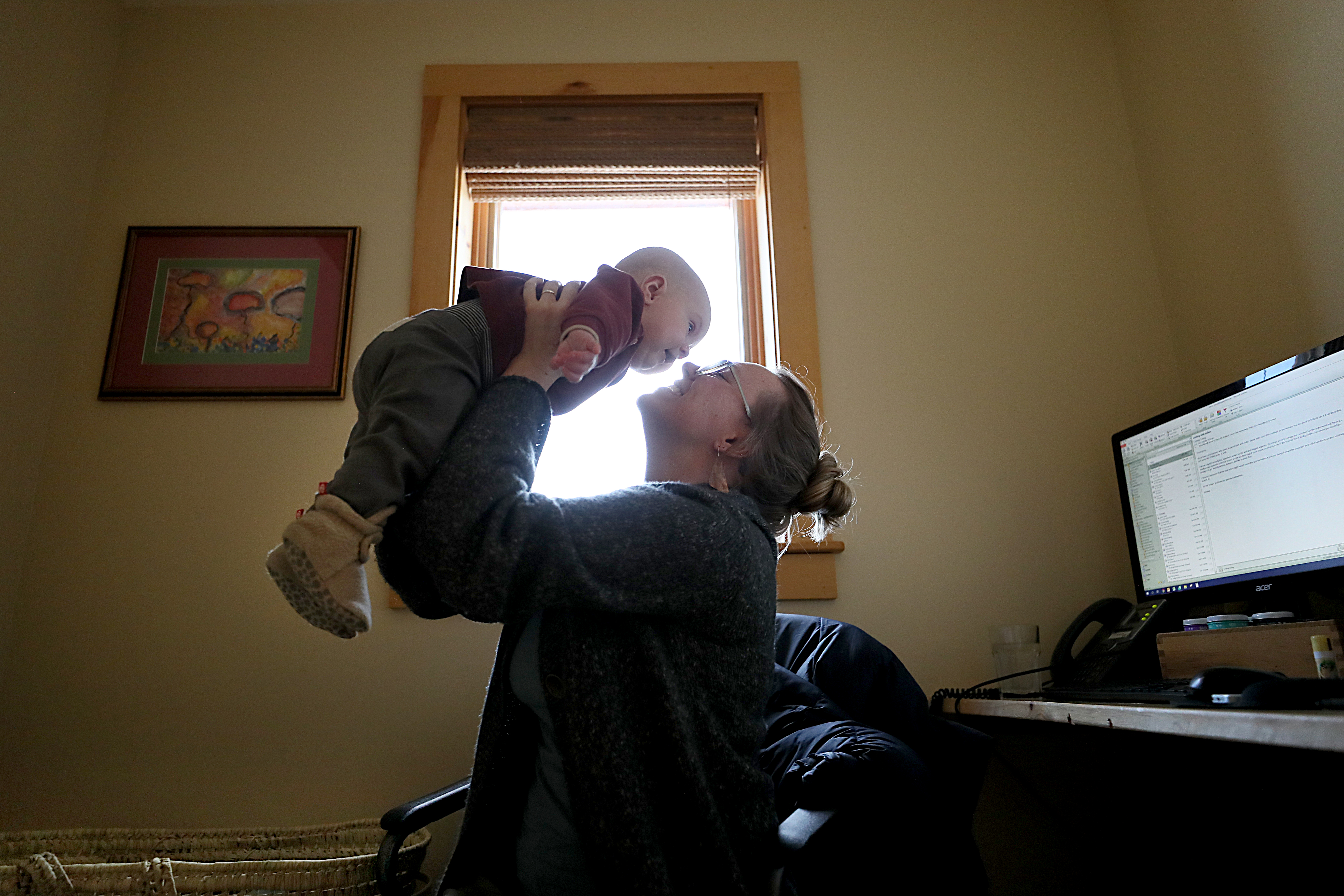 Mary Killgren had her six month old son Shamus, at work with her at WS Badger in Gilsum, N.H. on January 8, part of a small but growing trend of bringing babies to workplaces.