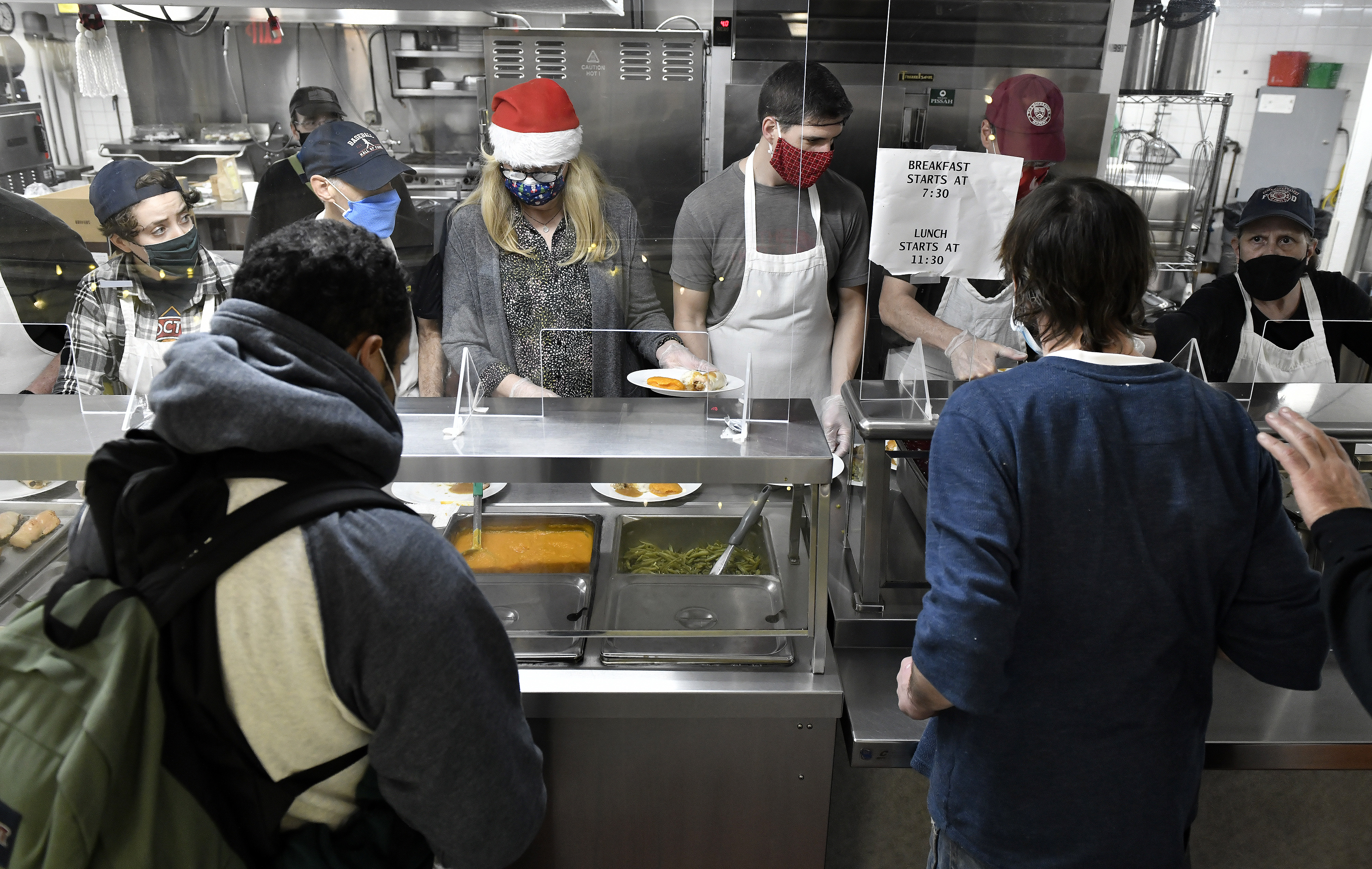 Twenty staff and 10 volunteers served lunch at the St. Francis House on Friday.