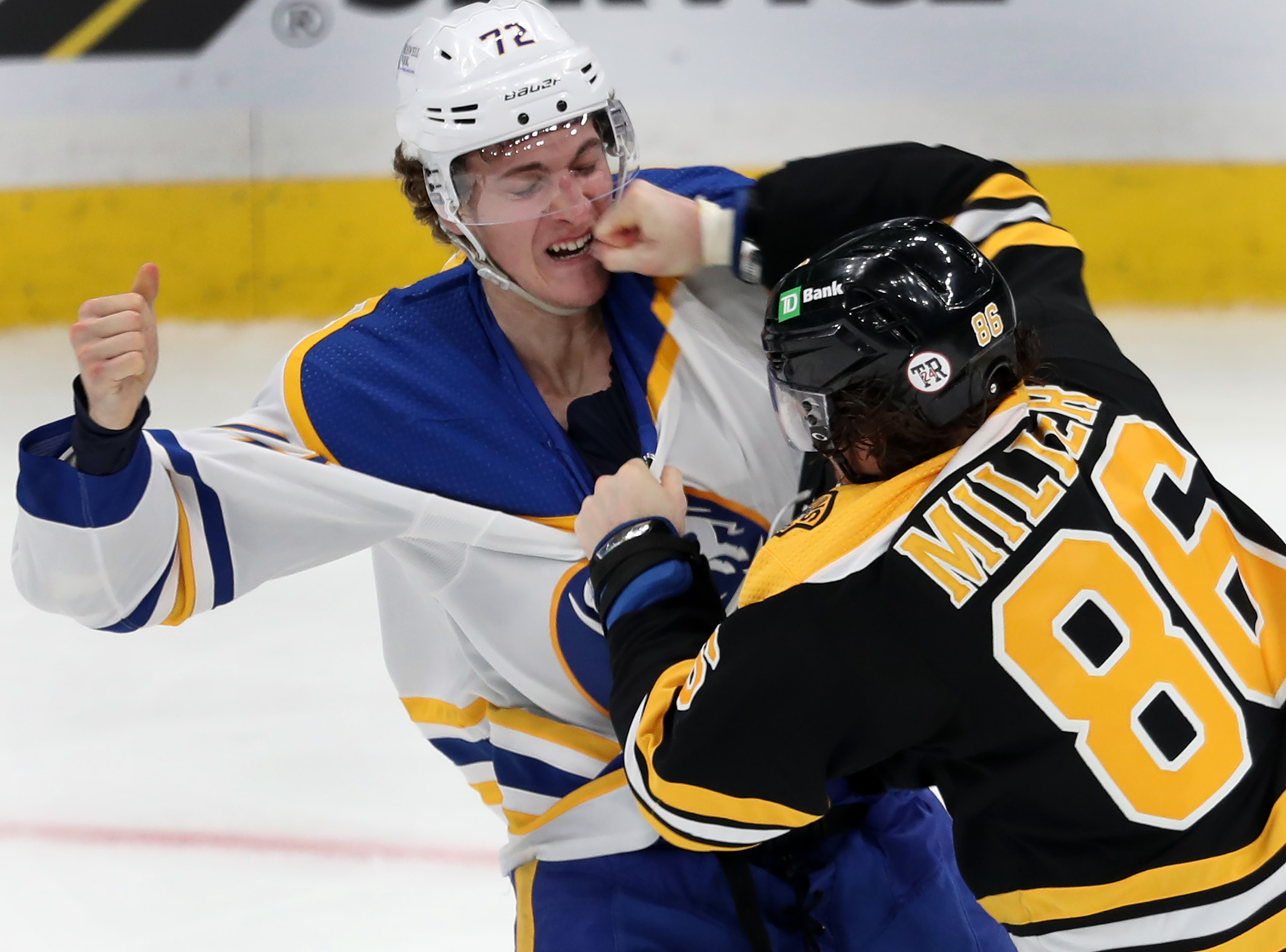 Kevan Miller (right) connected with a right to the face of Buffalo's Tage Thompson during a game last April.