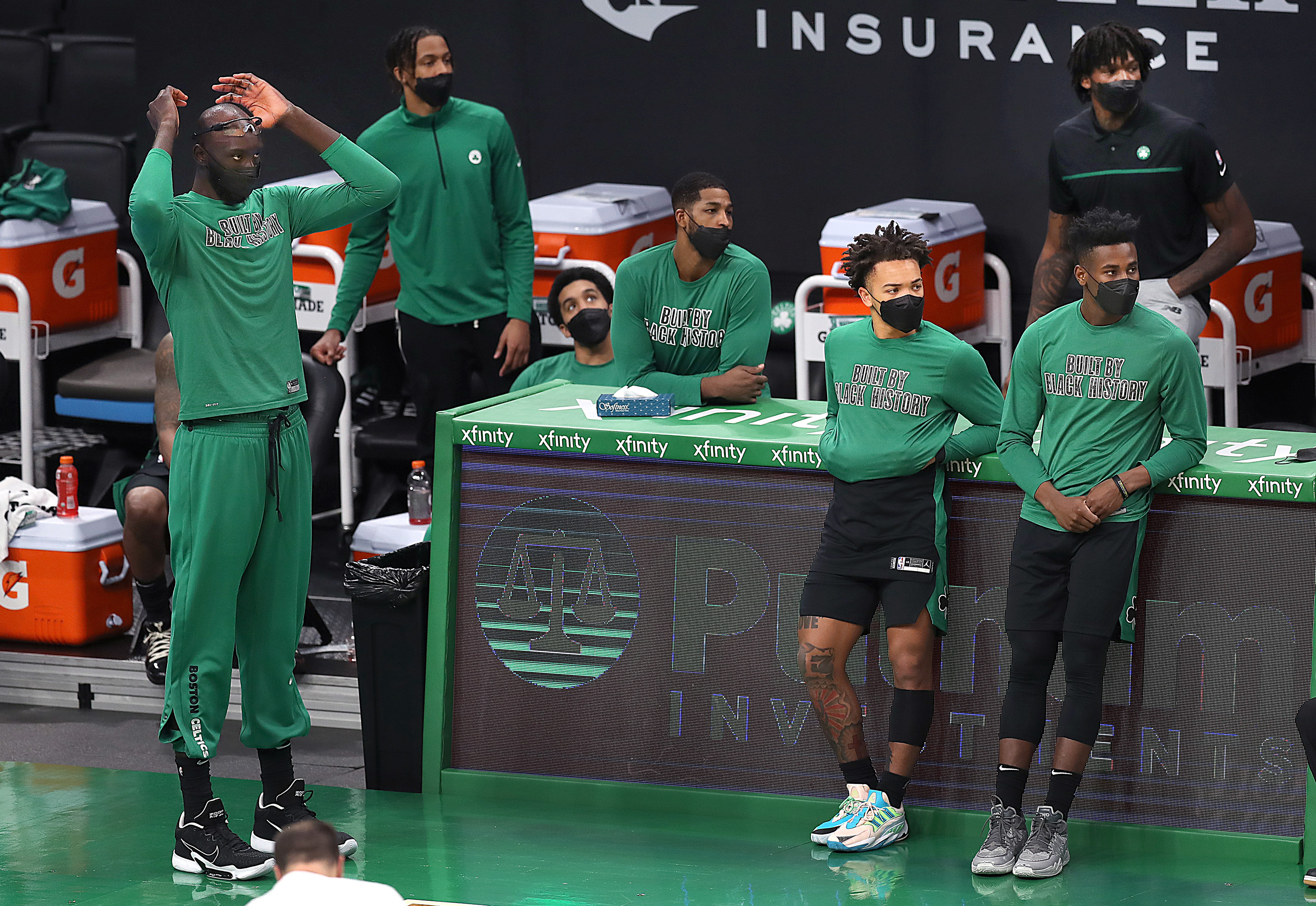 The Celtics bench shows the mood late in Friday night's loss to the Pistons.