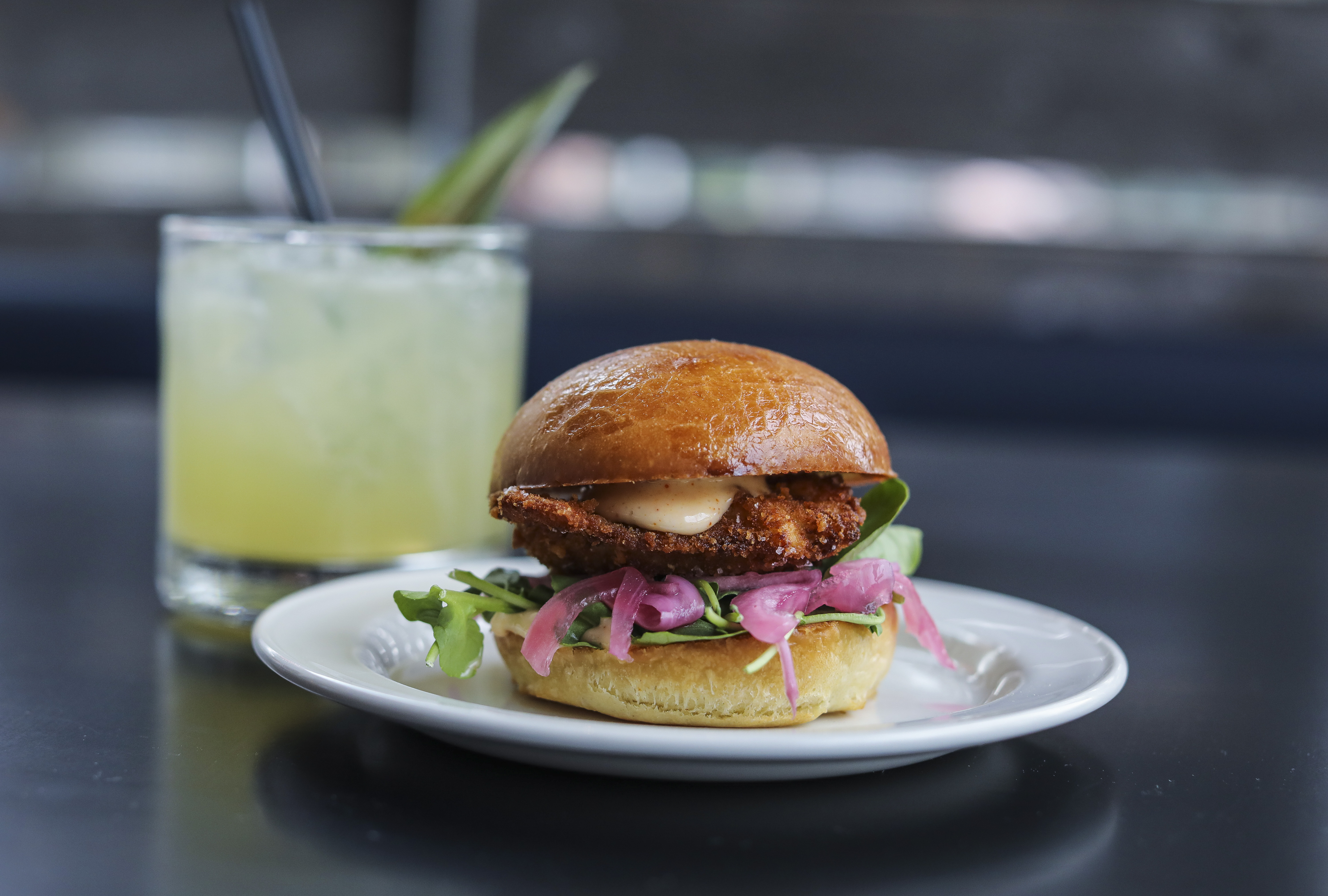 Crispy Oyster Slider served with chilli-lime aioli, pickled onions and watercress.