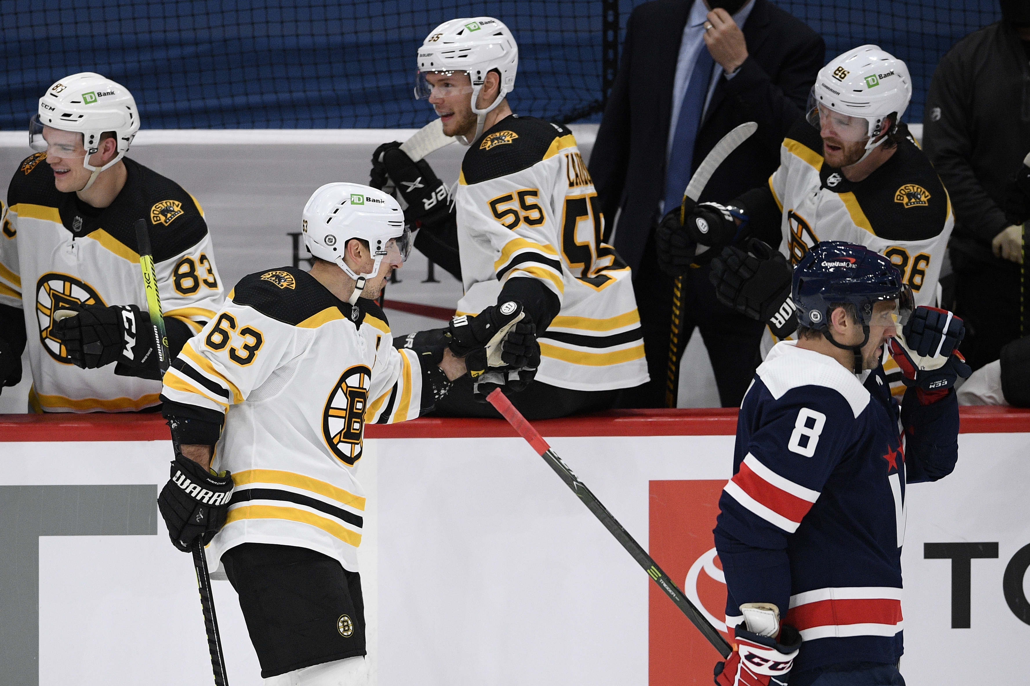 Brad Marchand celebrates his goal with Jeremy Lauzon during the second period of Thursday's game.