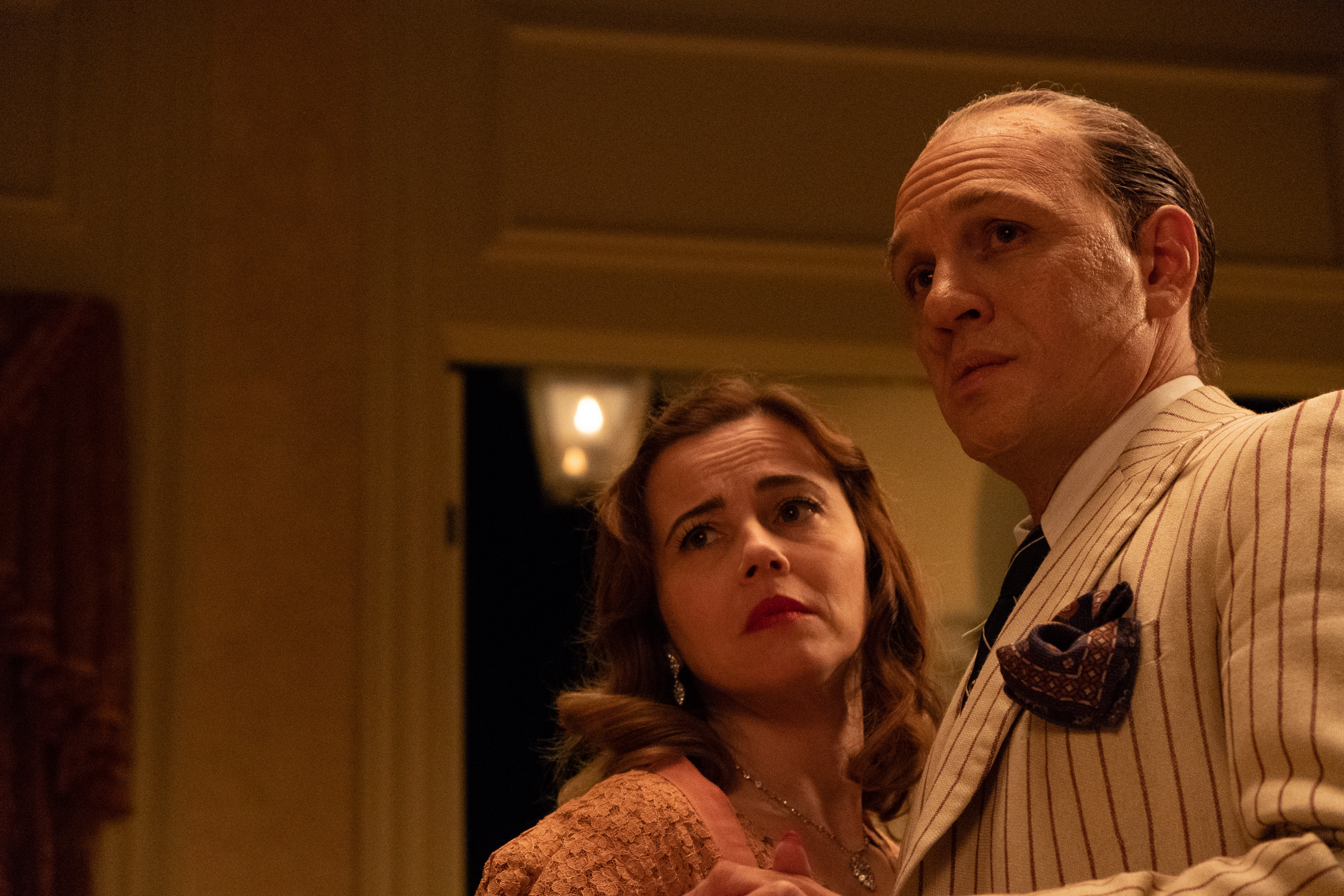 Linda Cardellini and Tom Hardy in "Capone."