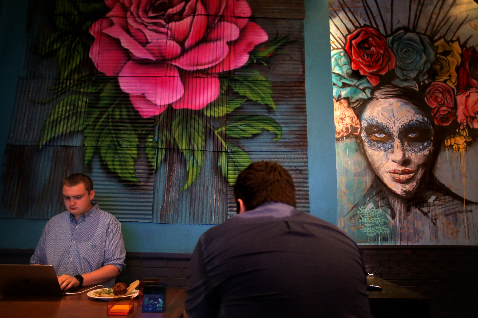 Zach Griffin and Patrick Dooley worked on their laptops inside the restaurant.