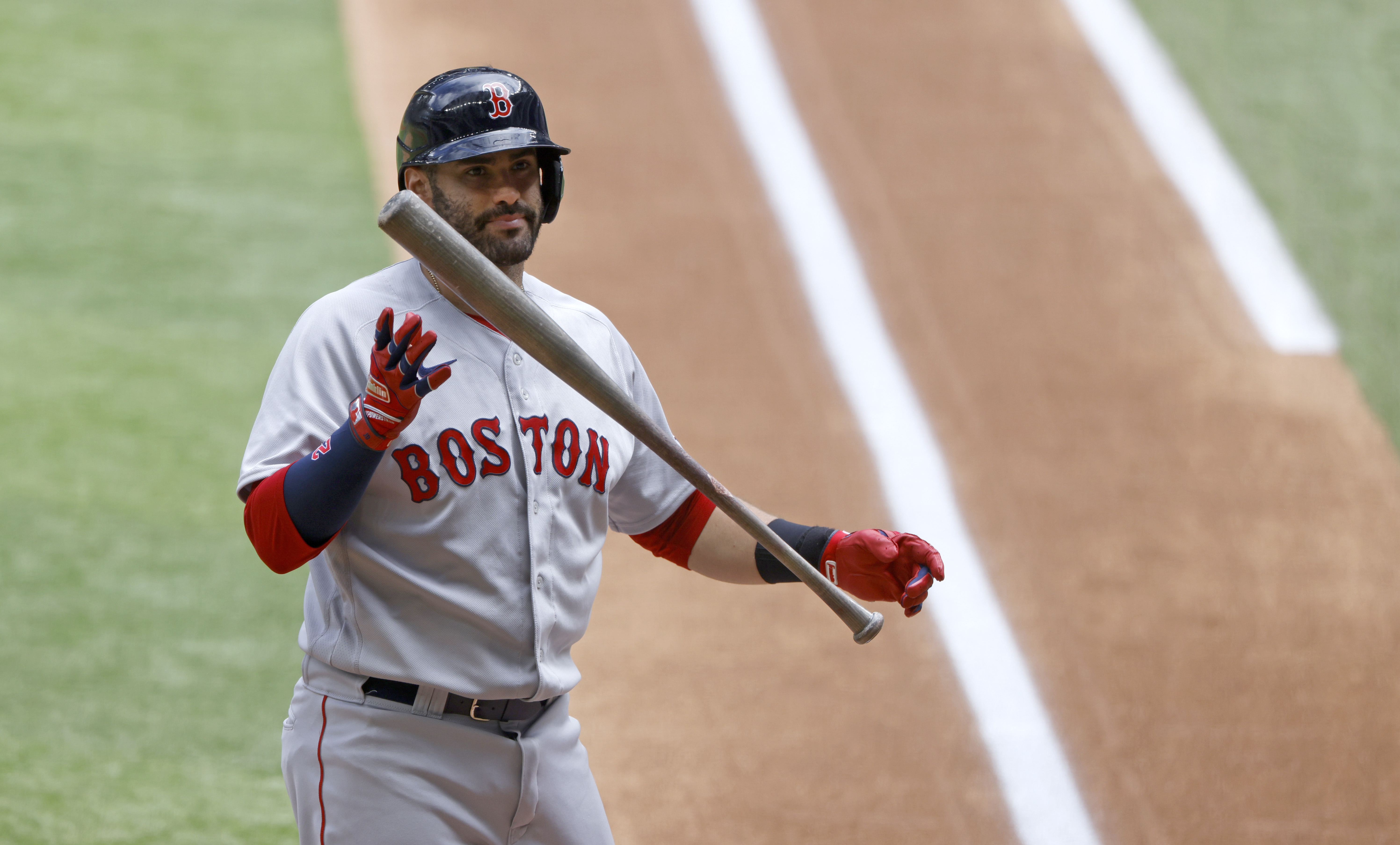J.D. Martinez reacts striking out in the first inning Sunday, one of seven Red Sox batters had in their 5-3 loss to the Rangers.