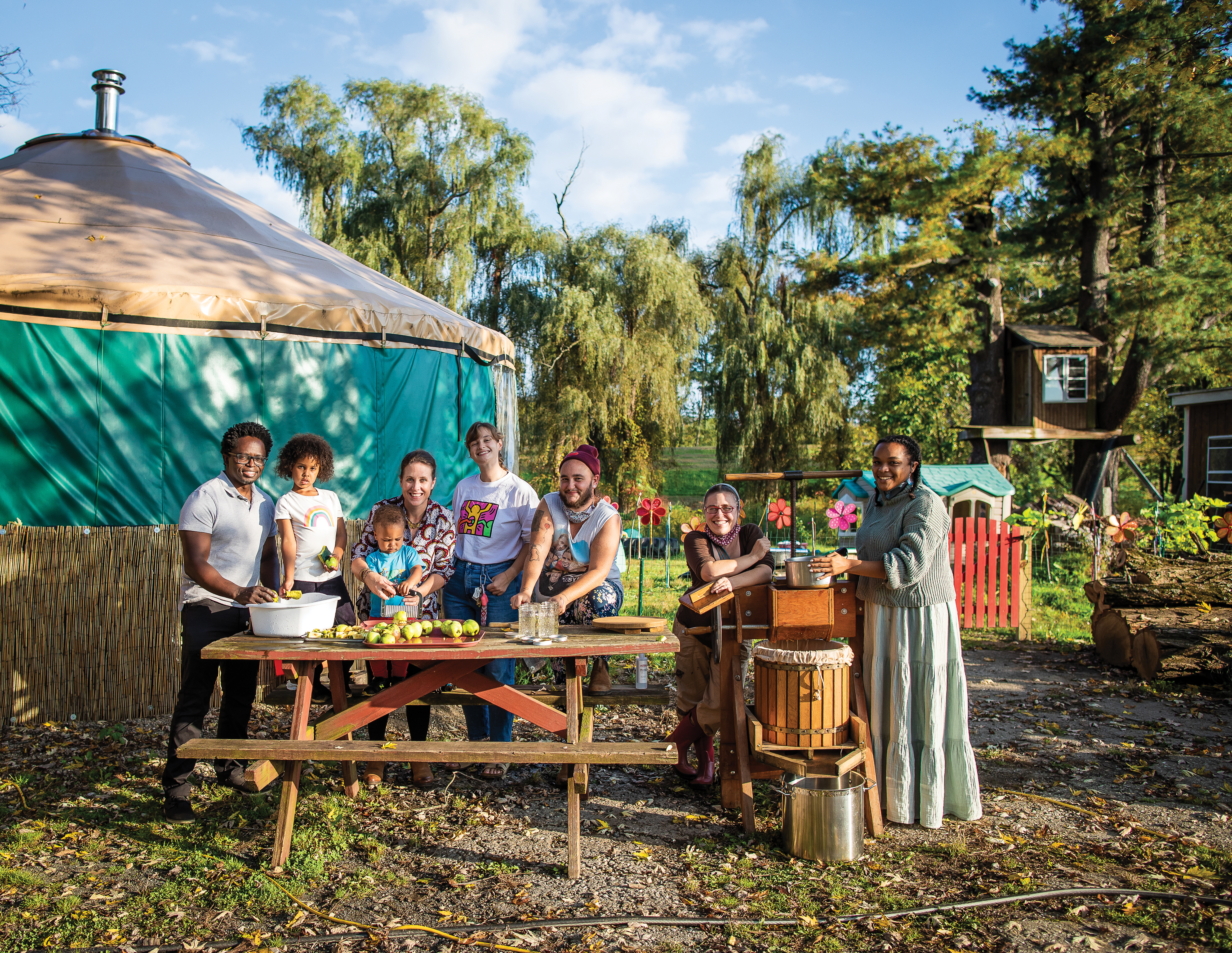 From left: Fungai Tichawangana with his daughter, Narini; Verity Norman-Tichawangana holding their son, Onekai; baby sitter Helen Woods; and Farm Hands Preschool teachers Jack Pierson, Erin Scanlon, and Odyssey Schroeder-Demmin.
