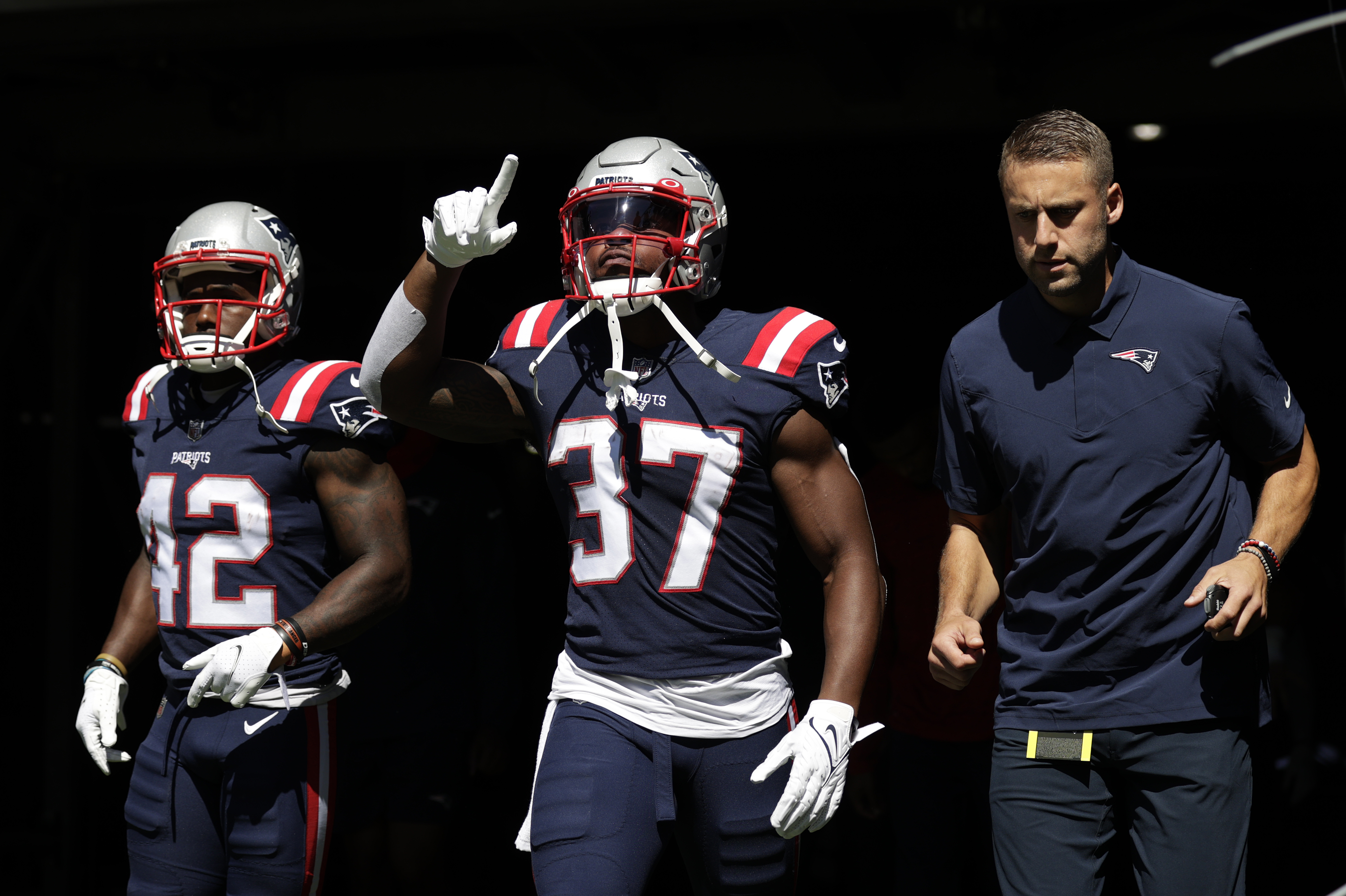Patriots running back Damien Harris (center) was flooded with angry messages after a crucial late fumble against the Dolphins in Week 1.