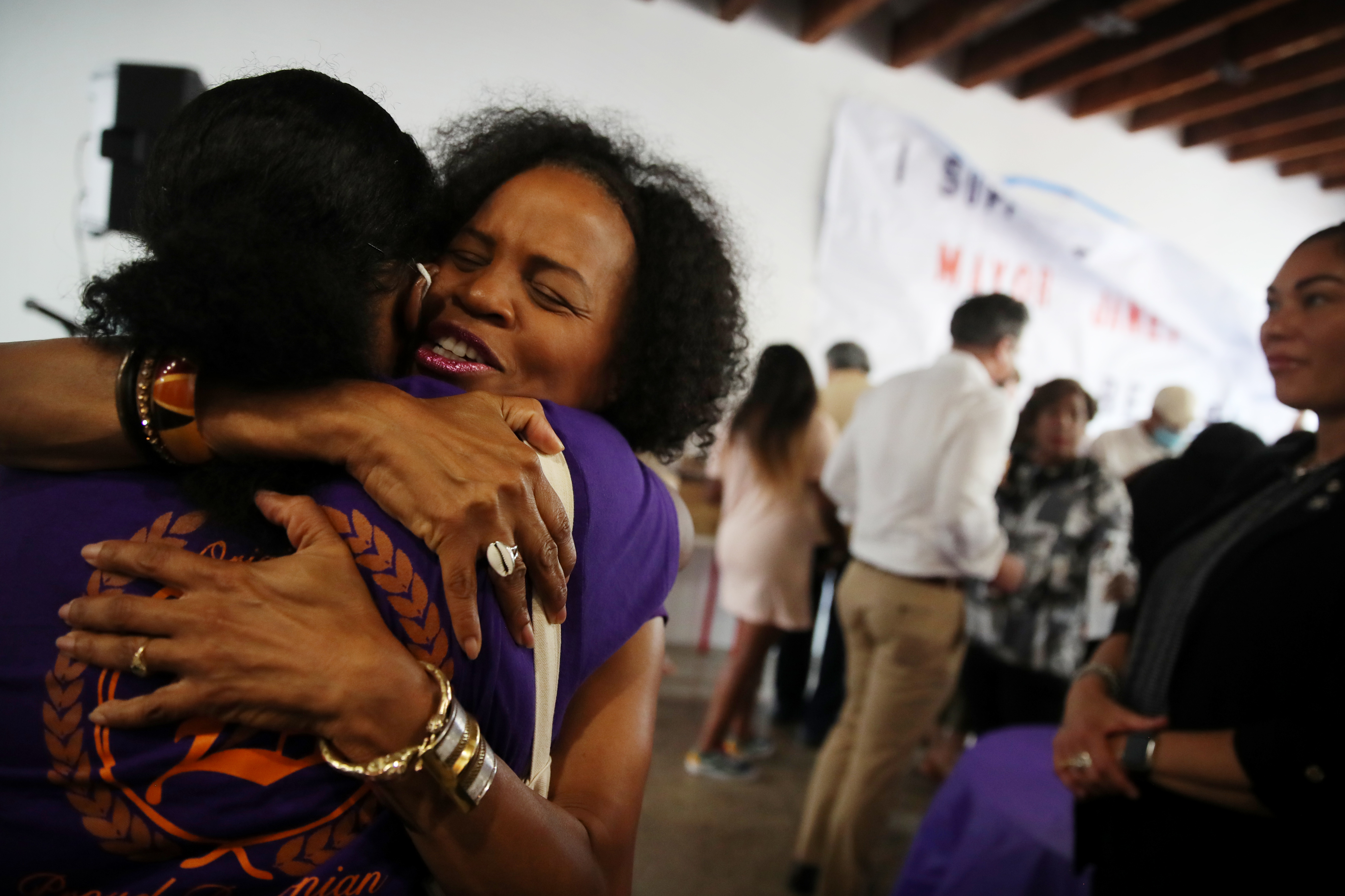 Acting Mayor Kim Janey embraced a supporter while celebrating a campaign office opening in Jamaica Plain.