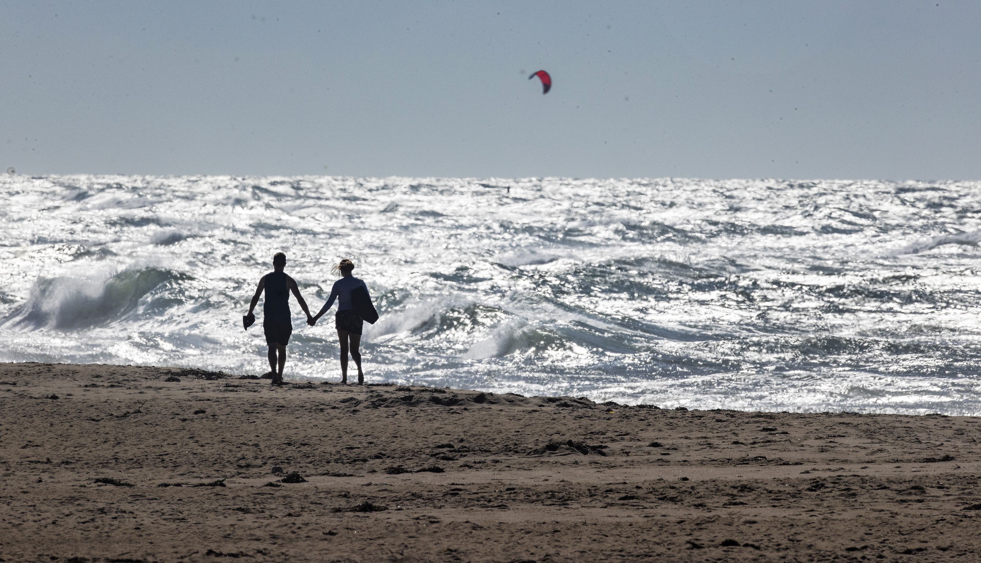 A couple walked along the beach of Madaket in Nantucket.
