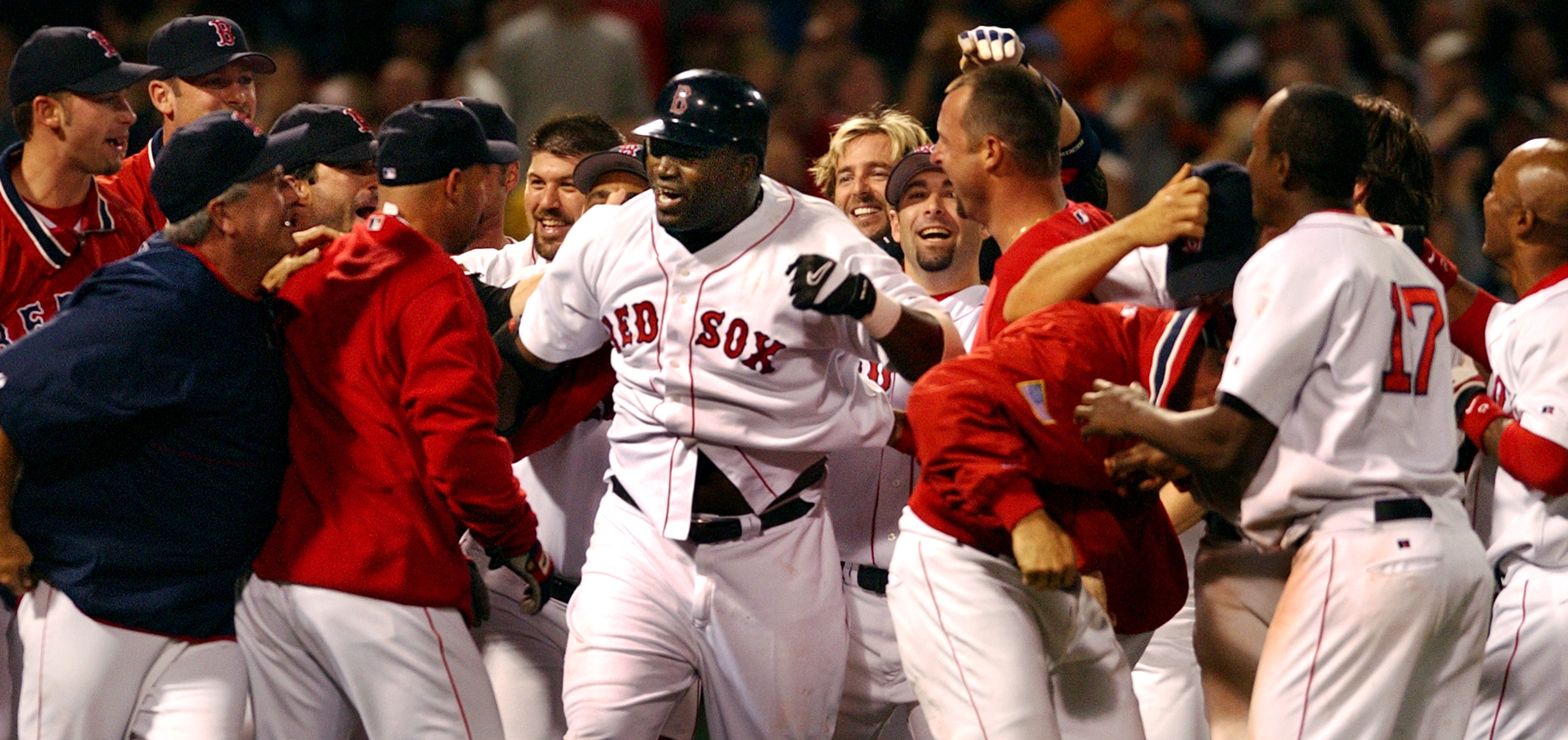 Ortiz's Red Sox teammates mob the slugger after he hit a solo home run in the 10th inning of a game against the Orioles on Sept. 23, 2003, to earn a comeback win.