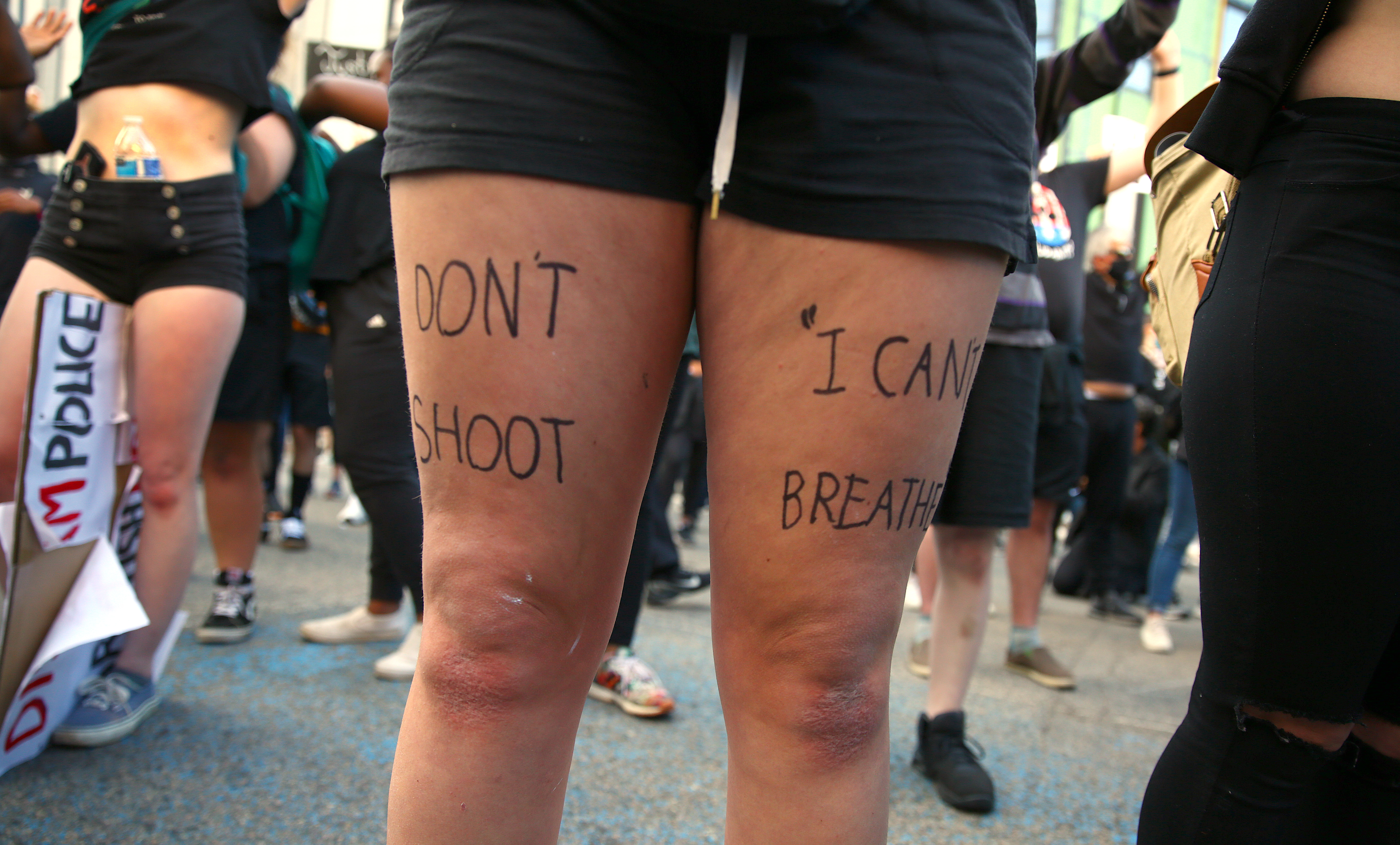 Meg Groffof had "Don't Shoot, I Can't Breath" written on her legs.