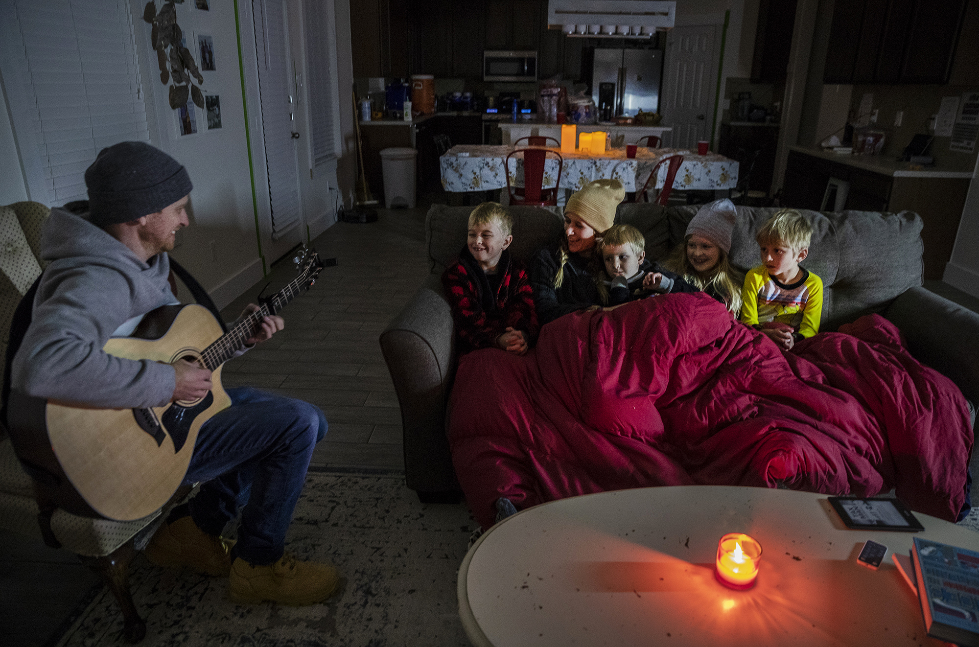 Brett Archibad tried to entertain his family as they attempt to stay warm in their home the BlackHawk neighborhood in Pflugerville, Texas on Tuesday.
