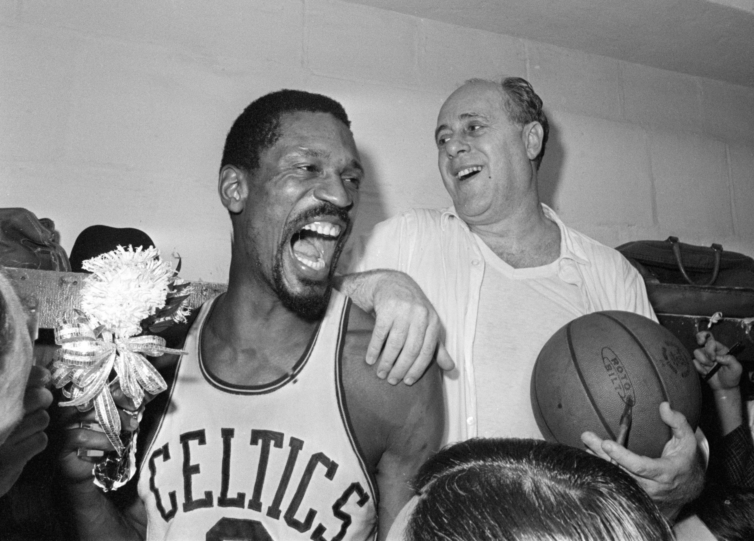 Bill Russell (left) and Red Auerbach, shown celebrating their 1966 NBA championship, both ended up on Shaughnessy's team.